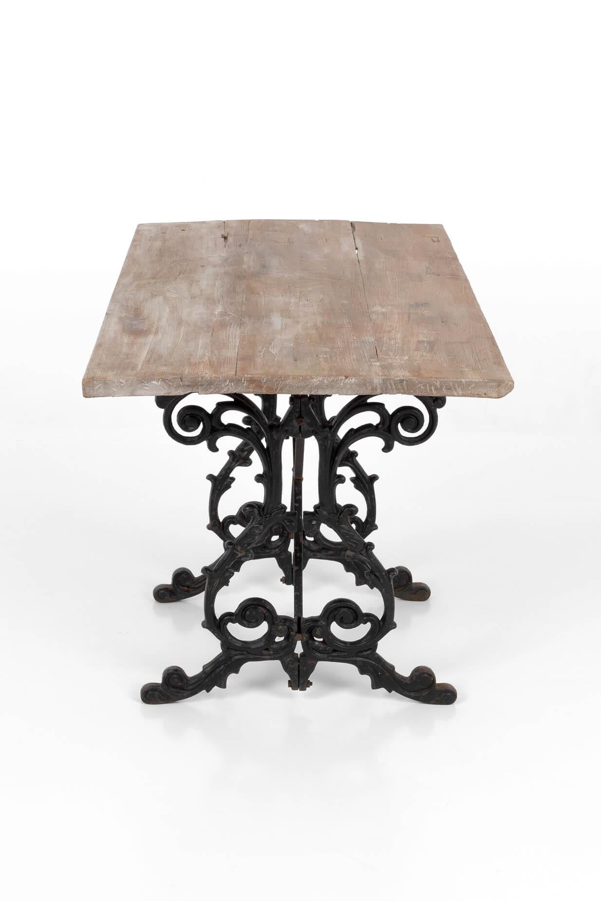 A Victorian hardwood garden table on a decorative cast iron base. Raised on splayed feet and united by a cross stretcher.
English, circa 1890.

Additional Information:
H 74 cm (H 29.1 inches)
W 65 cm (W 25.5 inches)
D 80 cm (D 31.4 inches).