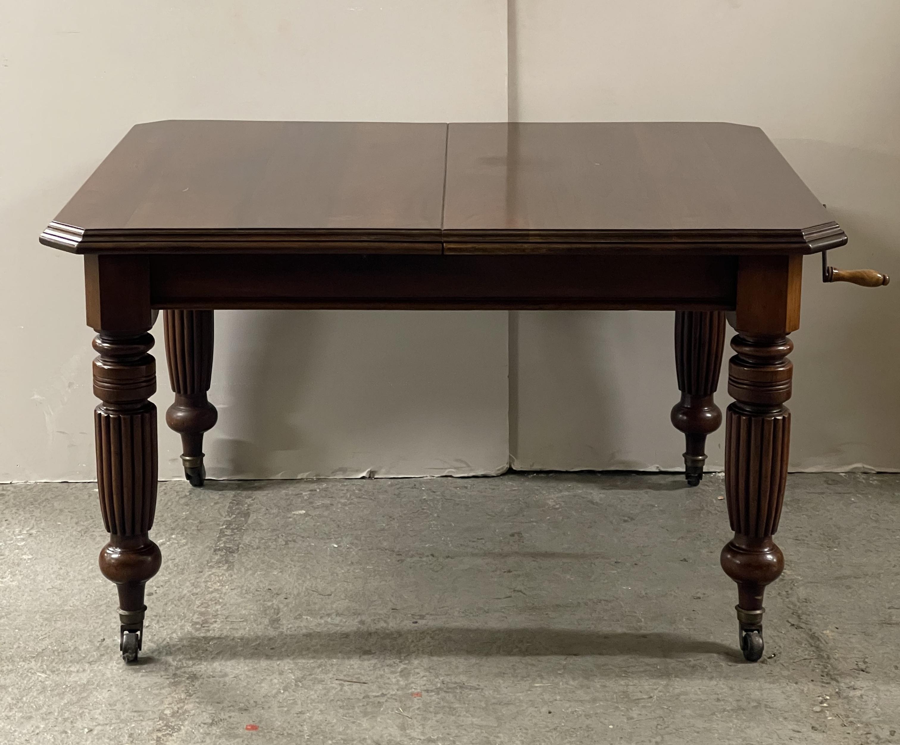English Victorian Hardwood Wind Out Extending Dining Table with Fluted Legs and Castors