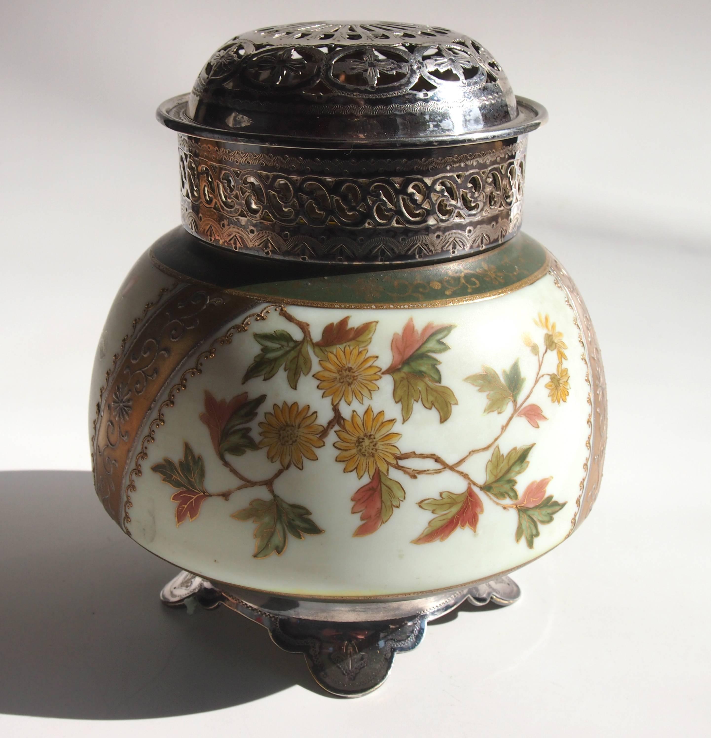 Unusual enameled and gilded Victorian Harrach Potpurri holder with original white metal feet and collar with detachable pierced lid and inner filter. Enameled with green gilded bands and floral decoration.

Harrach has been the backbone of Bohemian,