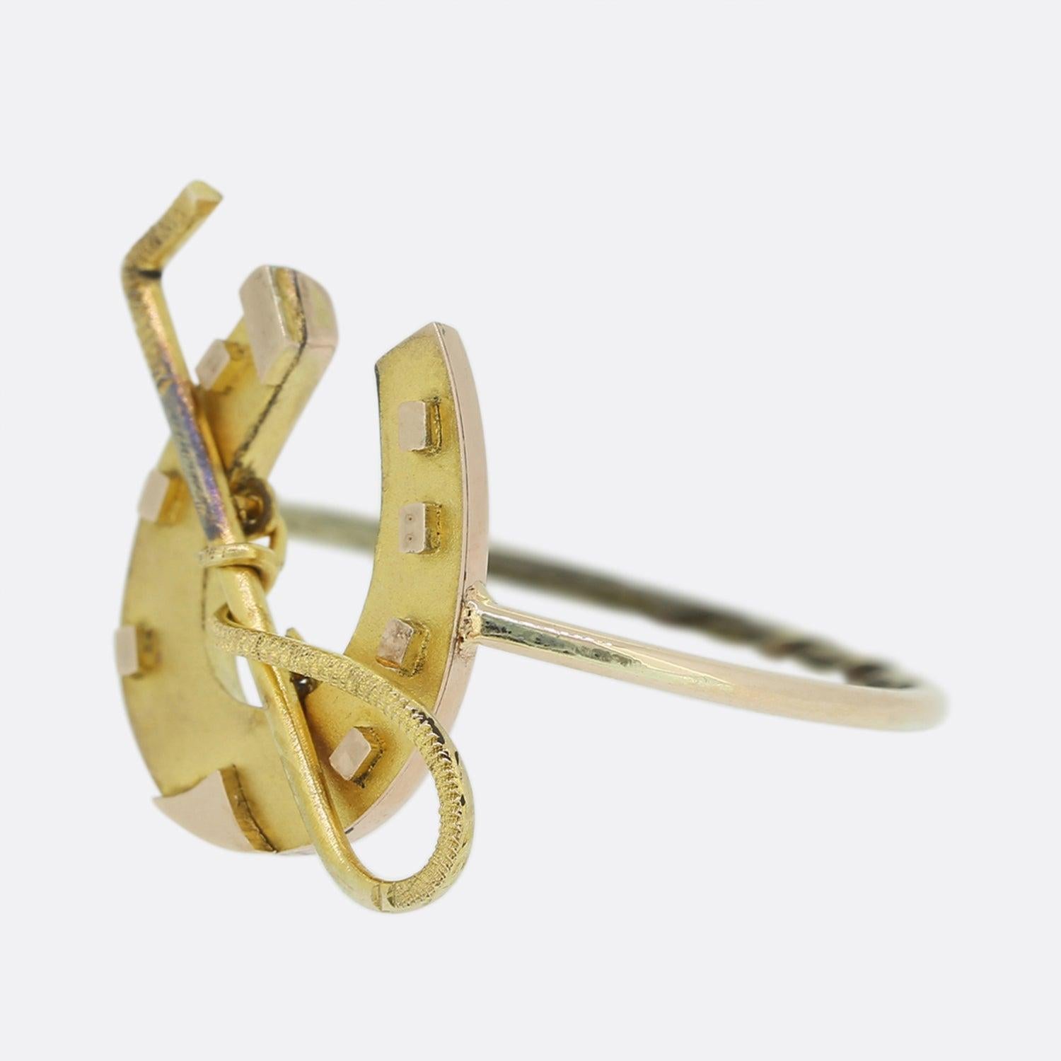 Here we have a fun 15ct yellow gold ring that originally dates back to the Victorian era. This ring has been crafted in the shape of a horseshoe and riding crop.
This piece started life as a pin but has been transformed into a ring by master antique