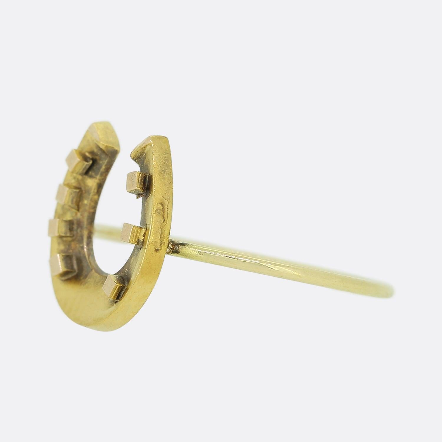 Here we have a charming Victorian horseshoe ring. The horseshoe features some dark tarnishing, we have left this as we feel it adds to the patina.

This piece started life as an antique stick pin but has been remodelled into a more practical ring,