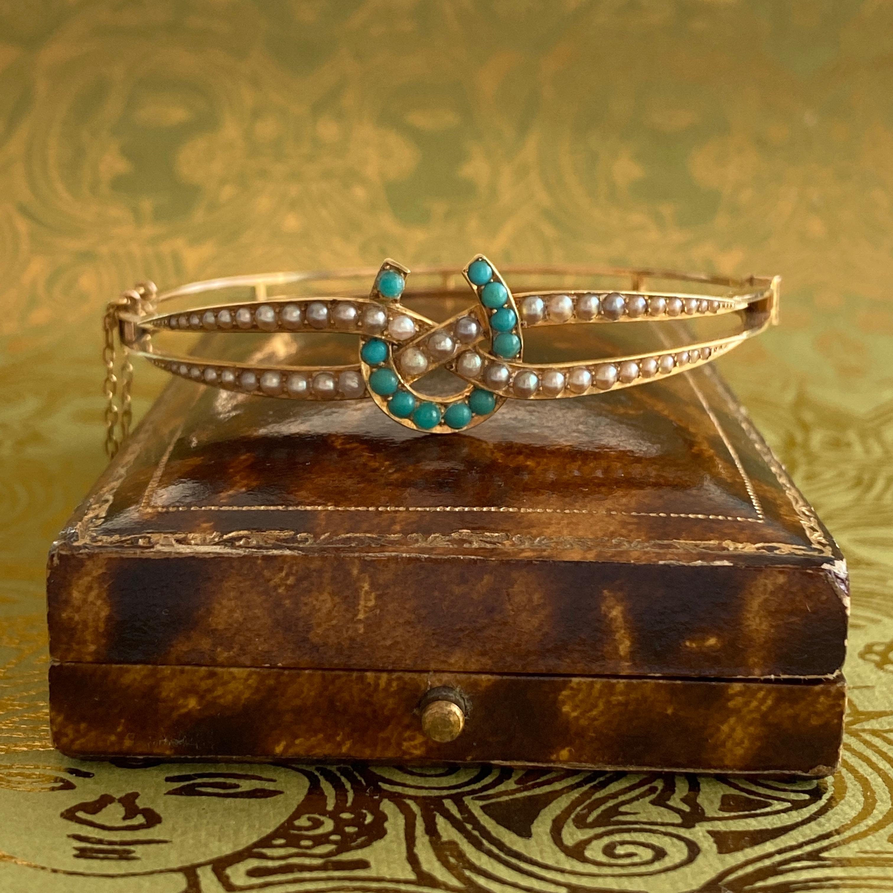 Details:
Sweet Victorian equestrian themed horseshoe bracelet in 14K yellow gold. Lovely delicate pearl and turquoise pattern along the front, with the horseshoe adorned with turquoise and the surrounding bracelet dotted with seed pearls. It has a
