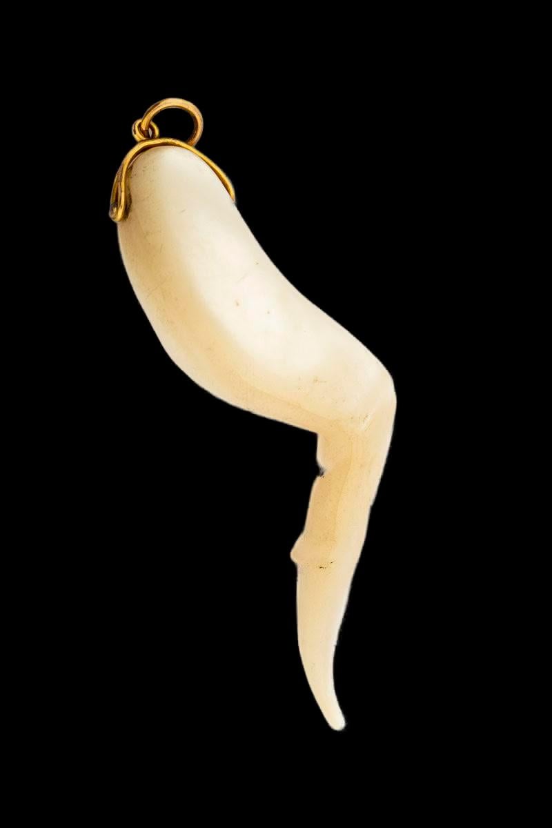 The antique cornicello, glows in smooth mother of pearl. It is silky, lustrous and tactile. It is beautiful in form. The cornicello or horn is a talisman worn to protect against the evil eye. Today made in plastic this beauty is unusual at 3 inches