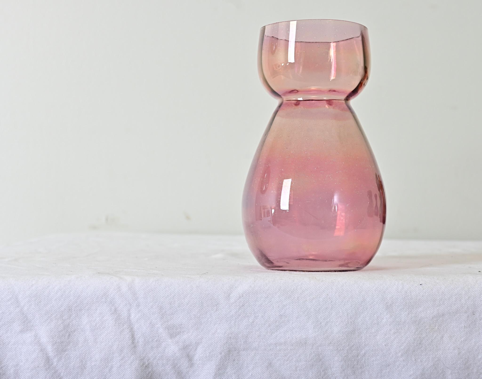 Hand rolled, blush-colored glass hyacinth forcing vase from the 1890’s. View the detailed images.