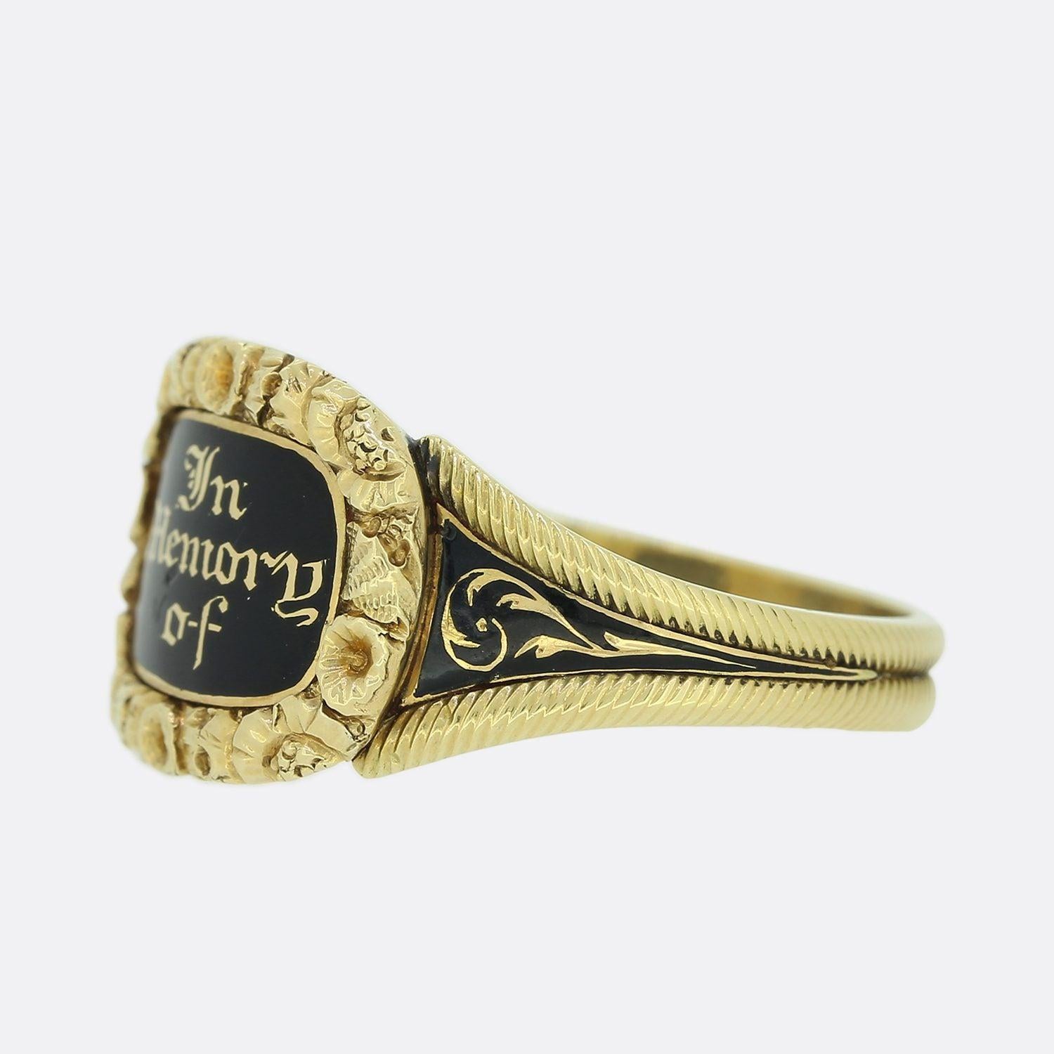 This is an exquisite mourning ring from the mid Victorian era. The head of the ring has the words 'In Memory Of' in black enamel with a carved floral border. The ring has been very well preserved and the enamel is in excellent condition. The