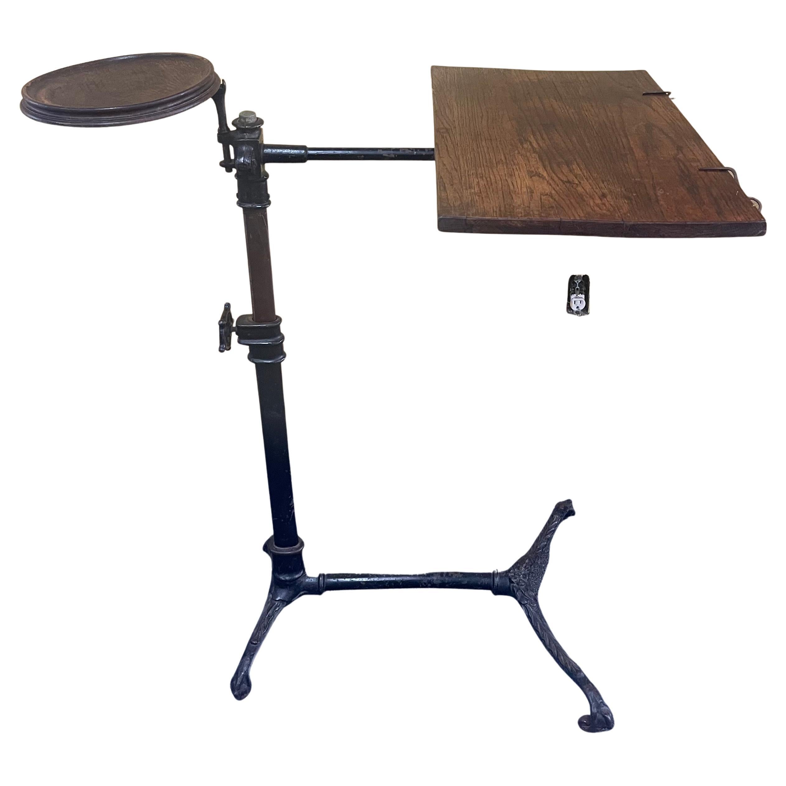 Victorian industrial cast iron drafting table or desk by J. Foot & Son of London, circa late 1800s. Table is a great, versatile size that can be used as a table or desk. The piece is signed J. Foot & Son, New Bond Street, London. Tiger oak veneer