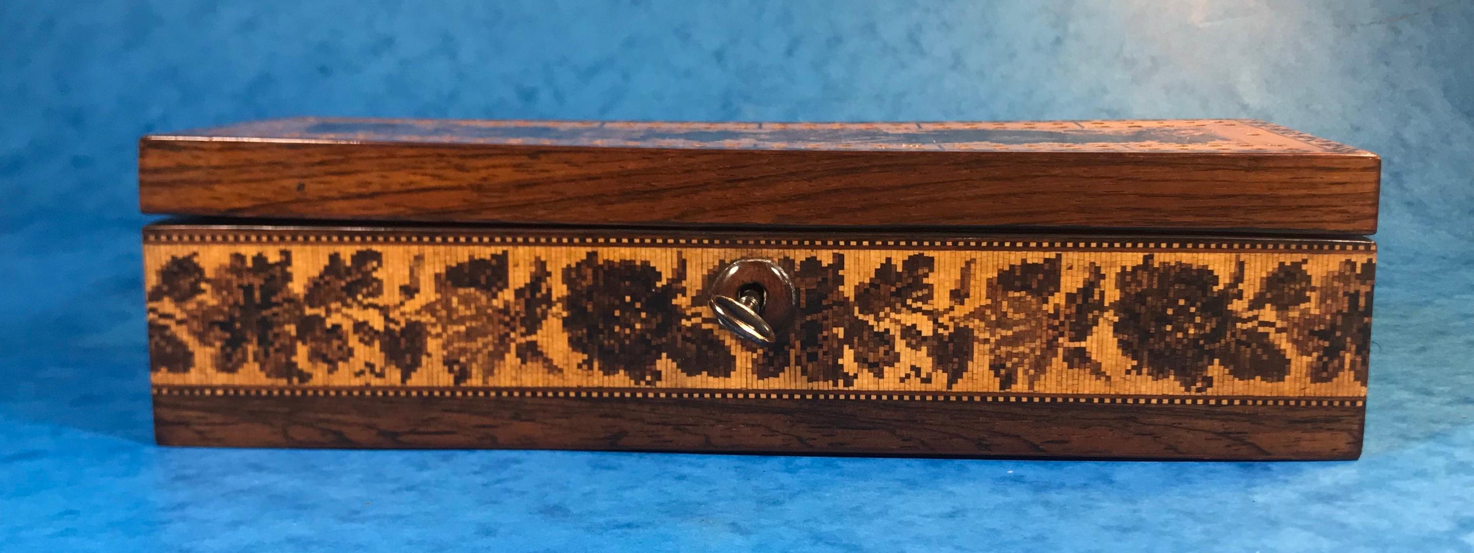 Victorian inlaid Tunbridge ware crib/games box.
Dating back to circa 1850, the crib box is rosewood with a decorative inlaid patten in floral Tunbridge Ware. It has a working lock and key, the interior has been relined with handcrafted marble