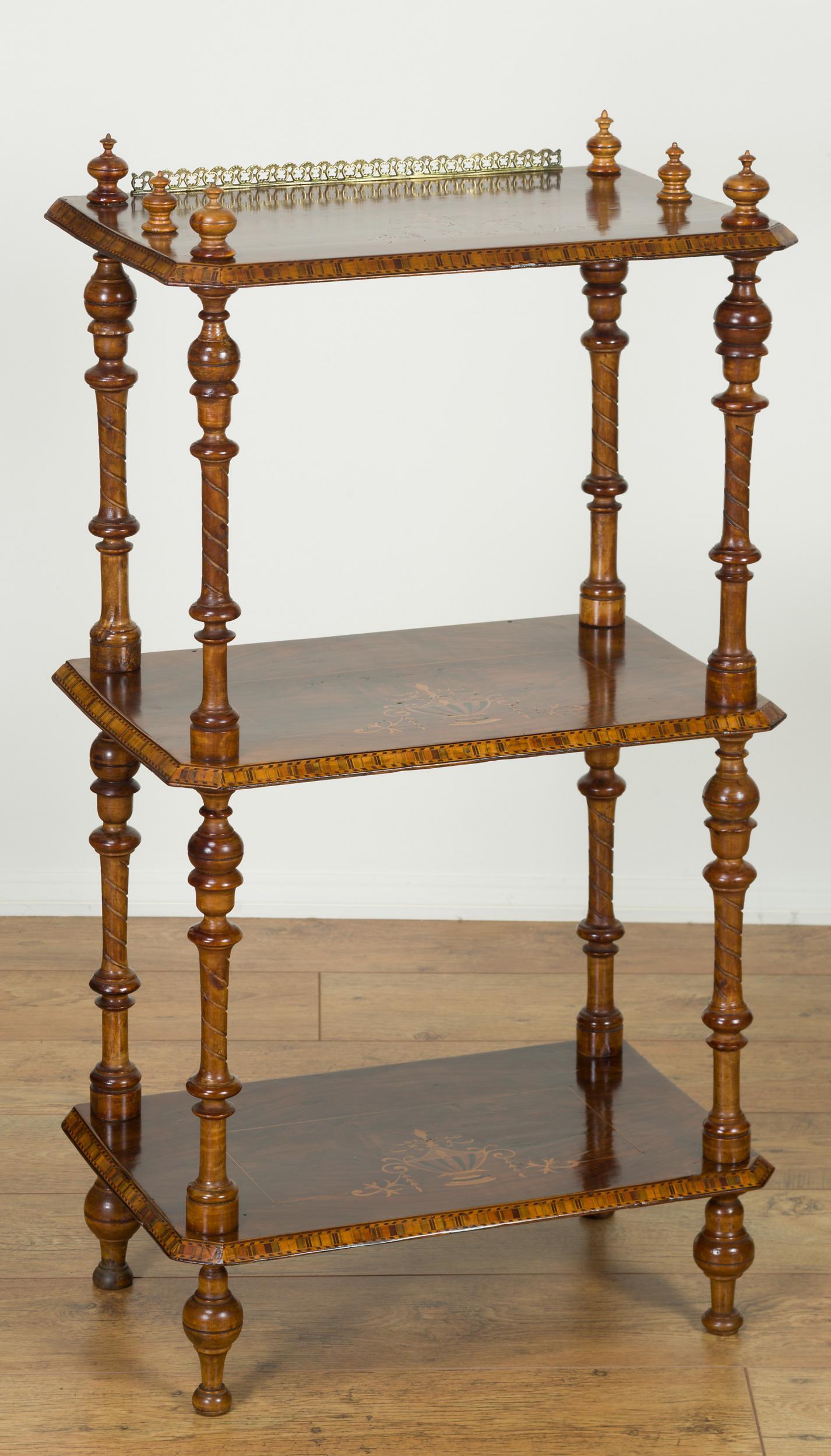 Victorian walnut three tier whatnot with satinwood and ebony inlays. 

Turned, carved supports with top finials and brass gallery, C.1870.