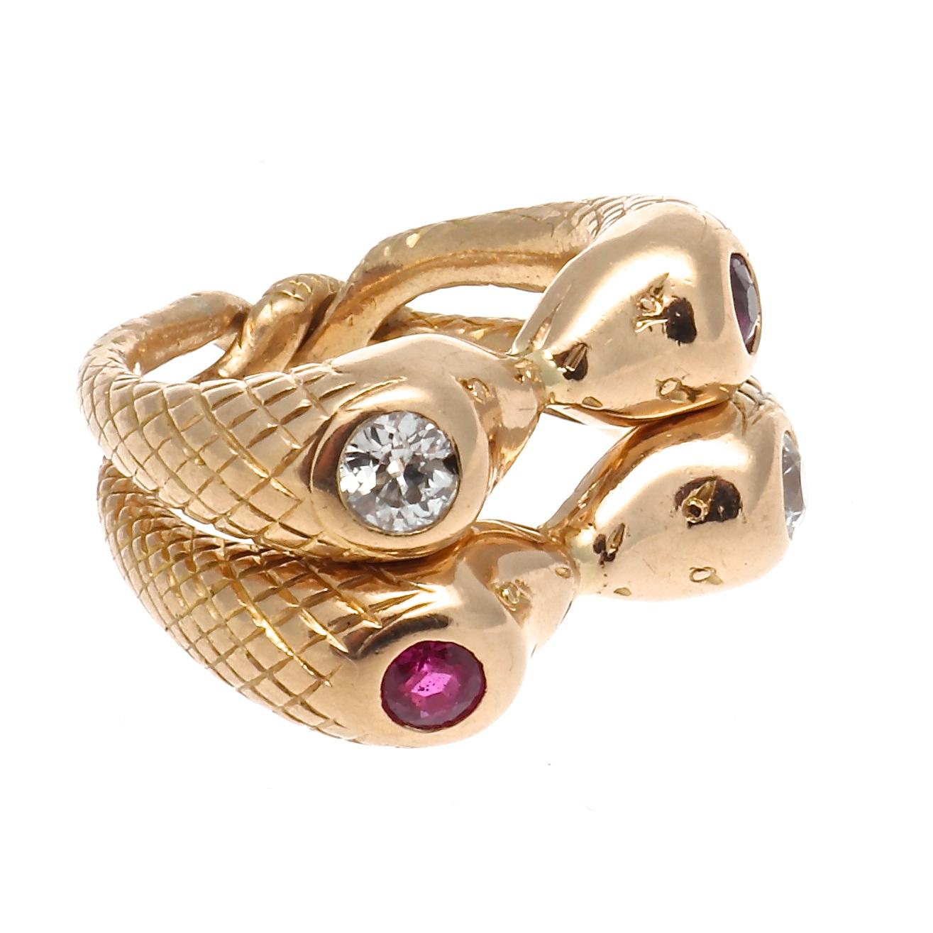 One Diamond Ruby 18 Karat Gold Snake Ring. Featuring two old European diamonds with a total weight of approximately 0.20 carats, graded H-I color, SI clarity. Accented by two round rubies with a total weight of approximately 0.20 carats. Crafted in