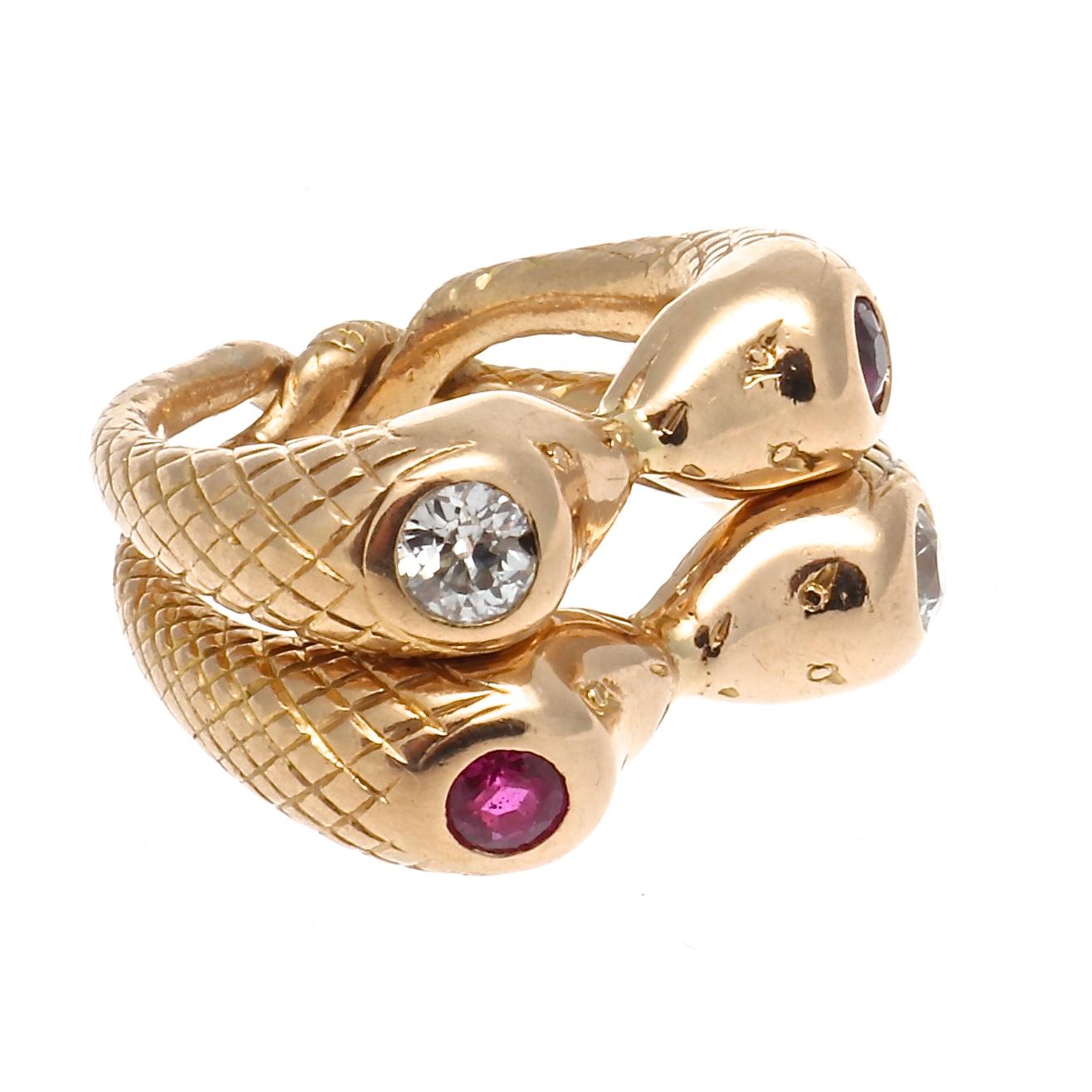 The serpent is one of the oldest mythological symbols representing wisdom, life and eternity. The snake motif has adorned jewelry for centuries and takes on infinite forms. Featuring combined gem encrusted heads of diamonds and rubies lovingly