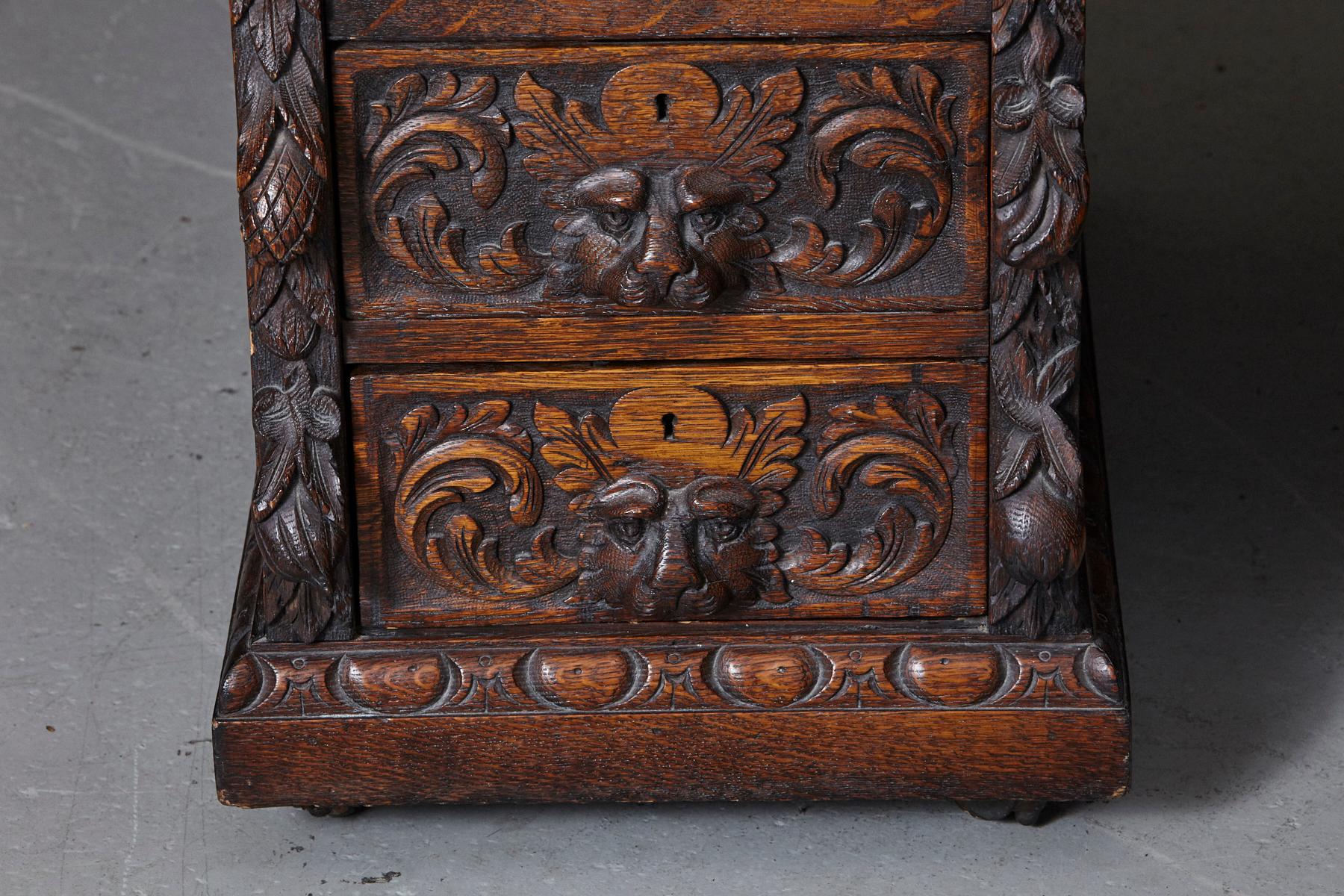 English Victorian Intricately Carved Oak Kneehole Desk with Lion Head Handles