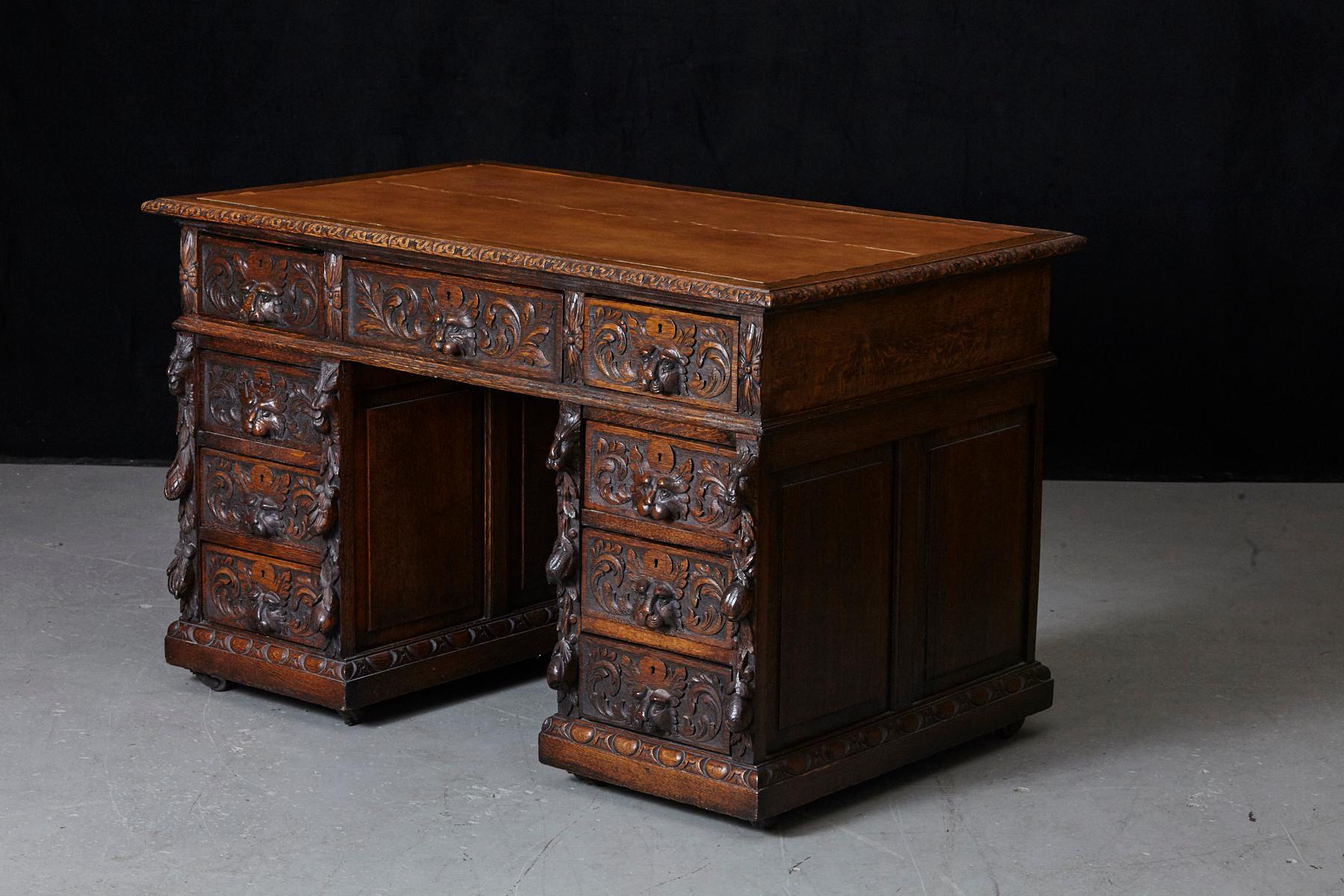 19th Century Victorian Intricately Carved Oak Kneehole Desk with Lion Head Handles