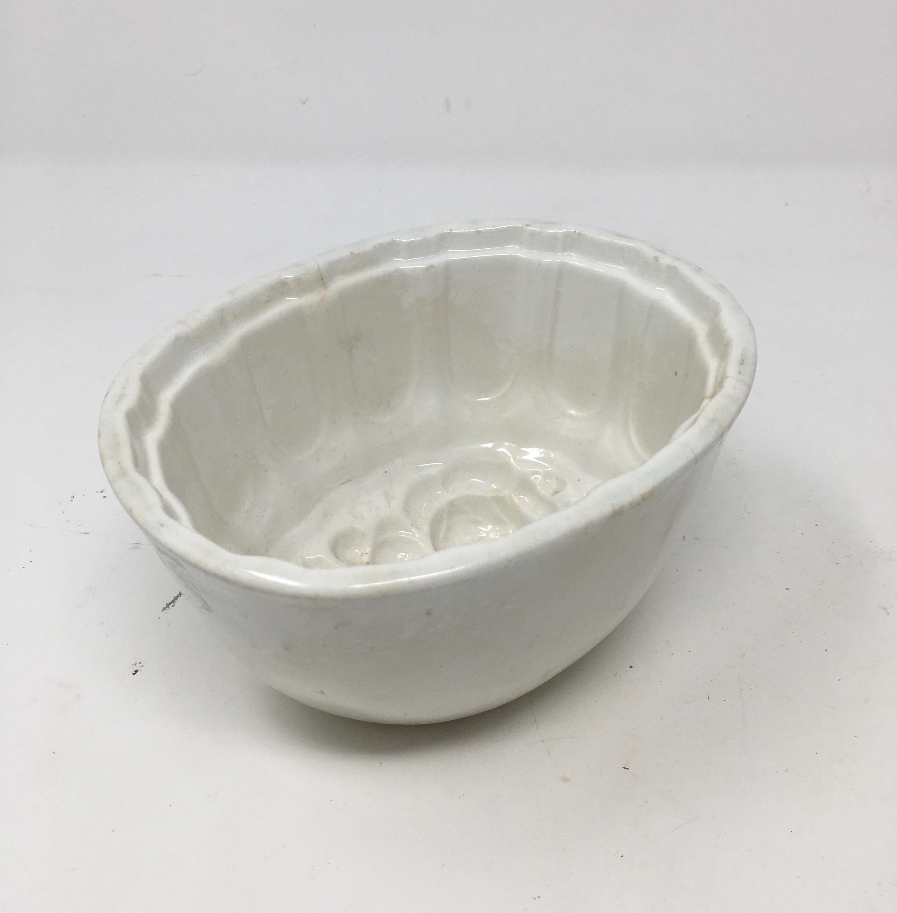 This Victorian Ironstone Mold, with a floral motif was used to mold several different food items such as jellies, aspic, meat and puddings into beautiful shapes served on a platter. The ornate pattern within the bowl would appear on the exterior of