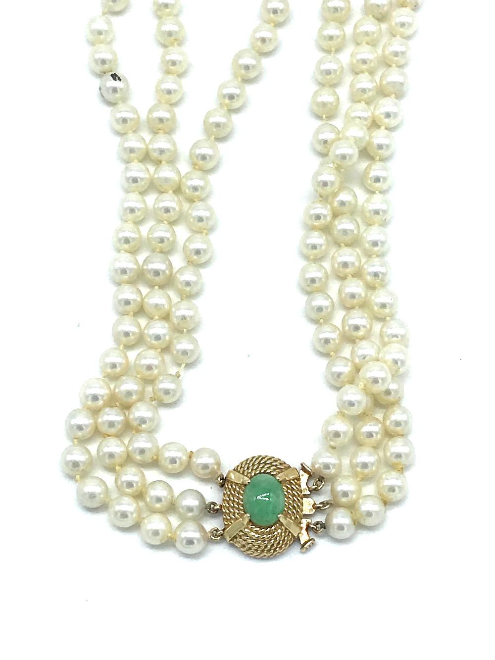 Vintage, Jade Clasp on 3-Strand 6 mm Pearl, Necklace 
Graduated rows measuring 15-16-1/2 inches in length. Large 14 karat gold oval shaped, rope textured clasp measuring 19.05 x 15.5 mm wide. Jade is marbled colored green 10 x 9 mm, oval shaped