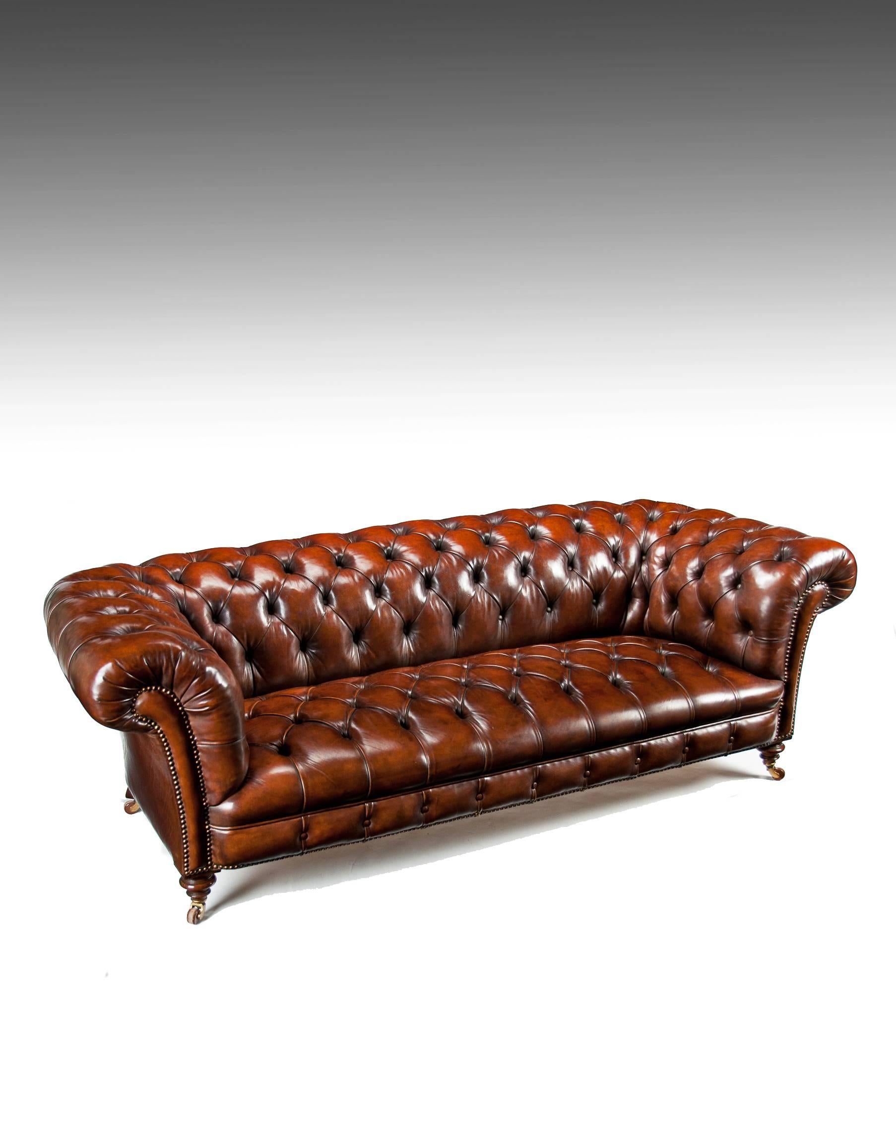 An extremely well-drawn 19th century Victorian walnut deep buttoned leather upholstered chesterfield stamped by the famous makers James Jas Shoolbred and Co London. Along with Howard and Sons Jas Shoolbred are two of the most sought after names in