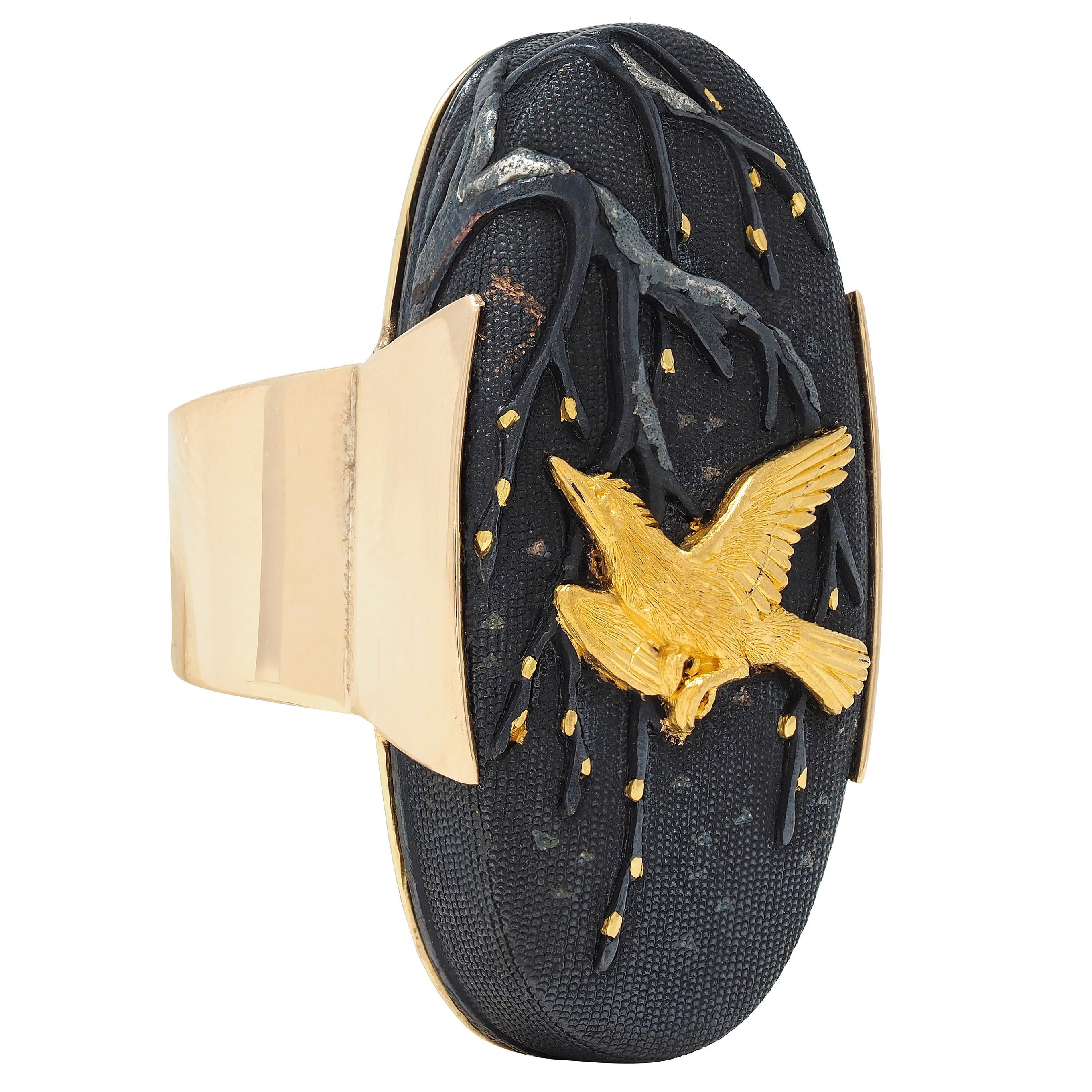 Centering an oval-shaped Kashira - a decorative cap once adorning the hilt of a sword 
Measuring 18.0 x 38.0 mm - textured with stipple-like surface called 