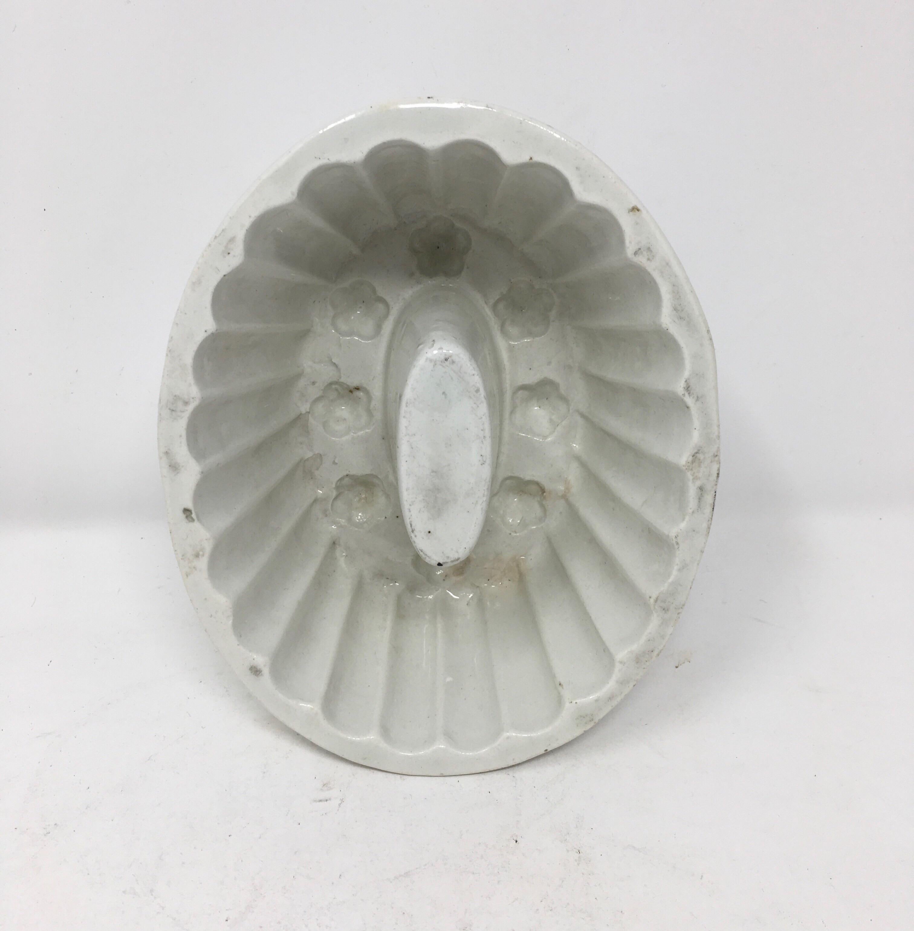 This Victorian ironstone mold with a charming floral motif, was used to mold several different food items such as jellies, aspic, meat and puddings into beautiful shapes served on a platter. The ornate pattern within the bowl would appear on the