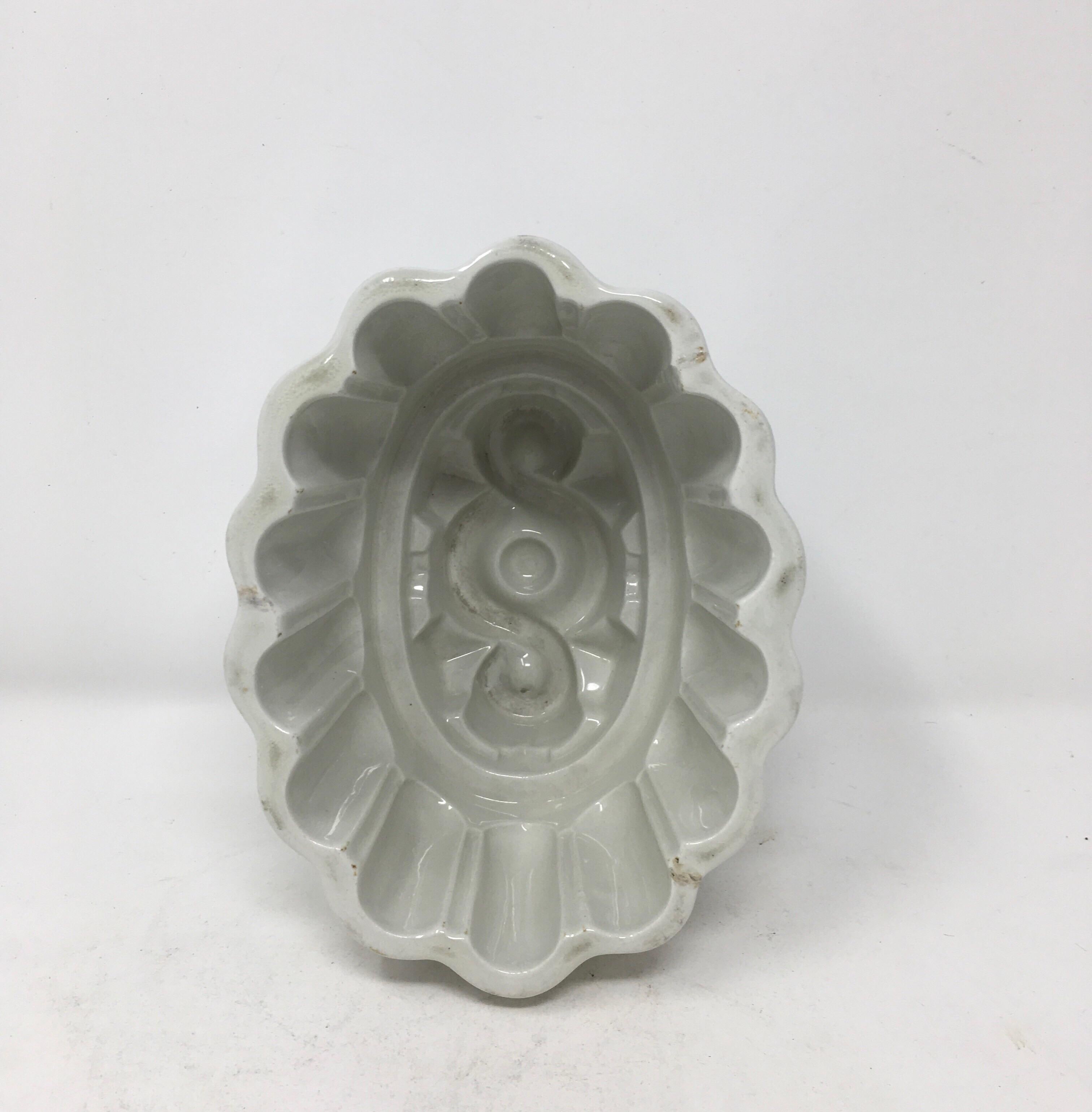 This Victorian ironstone mold with a charming geometric motif, was used to mold several different food items such as jellies, aspic, meat and puddings into beautiful shapes served on a platter. The ornate pattern within the bowl would appear on the