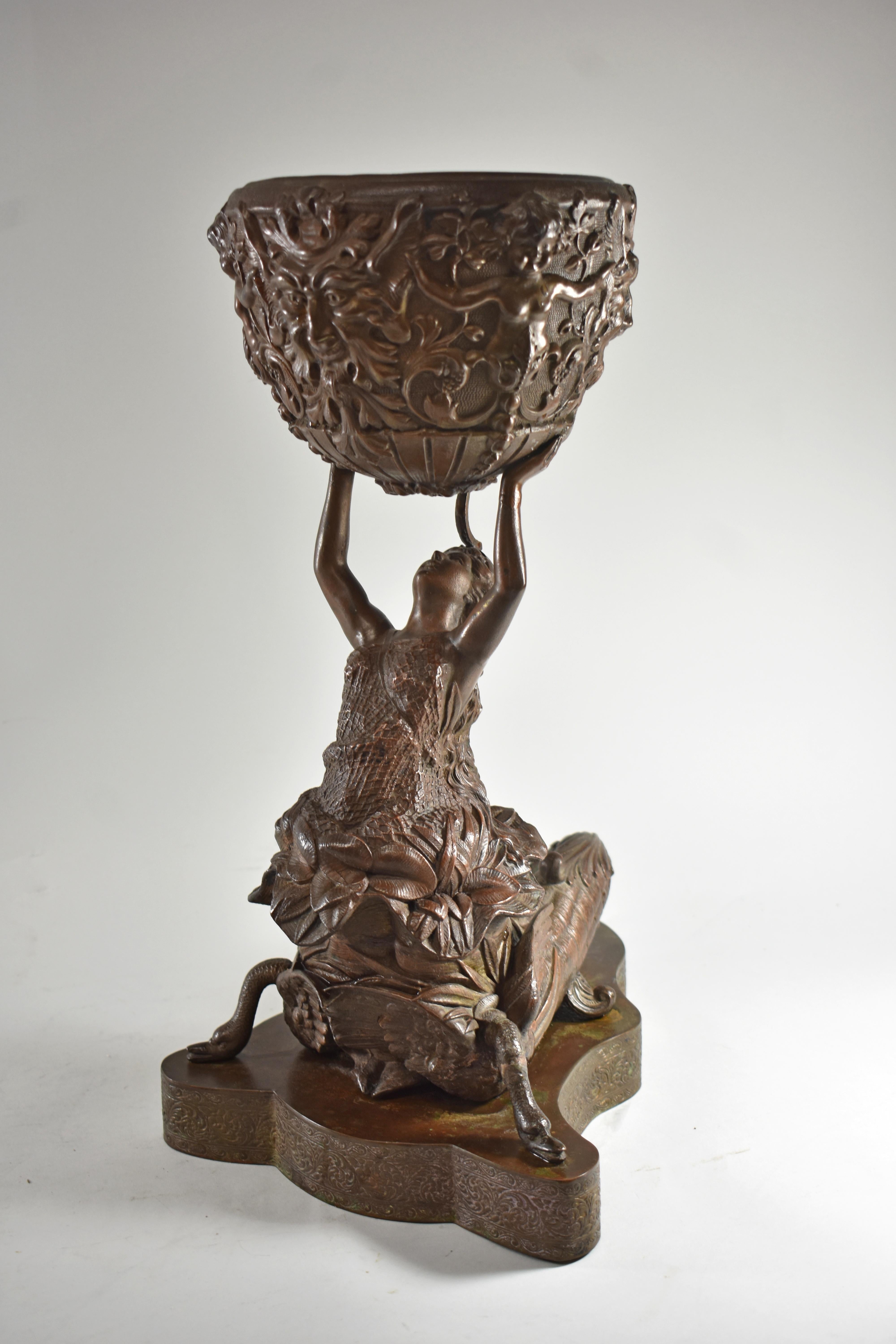 Victorian kerosene oil lamp base by N. Muller's & Sons. Figural mermaid with cornucopia body supported by two swans. She is holding up a bowl with cupid and Bacchus reliefs. Stamped N. Muller's & Sons New York.