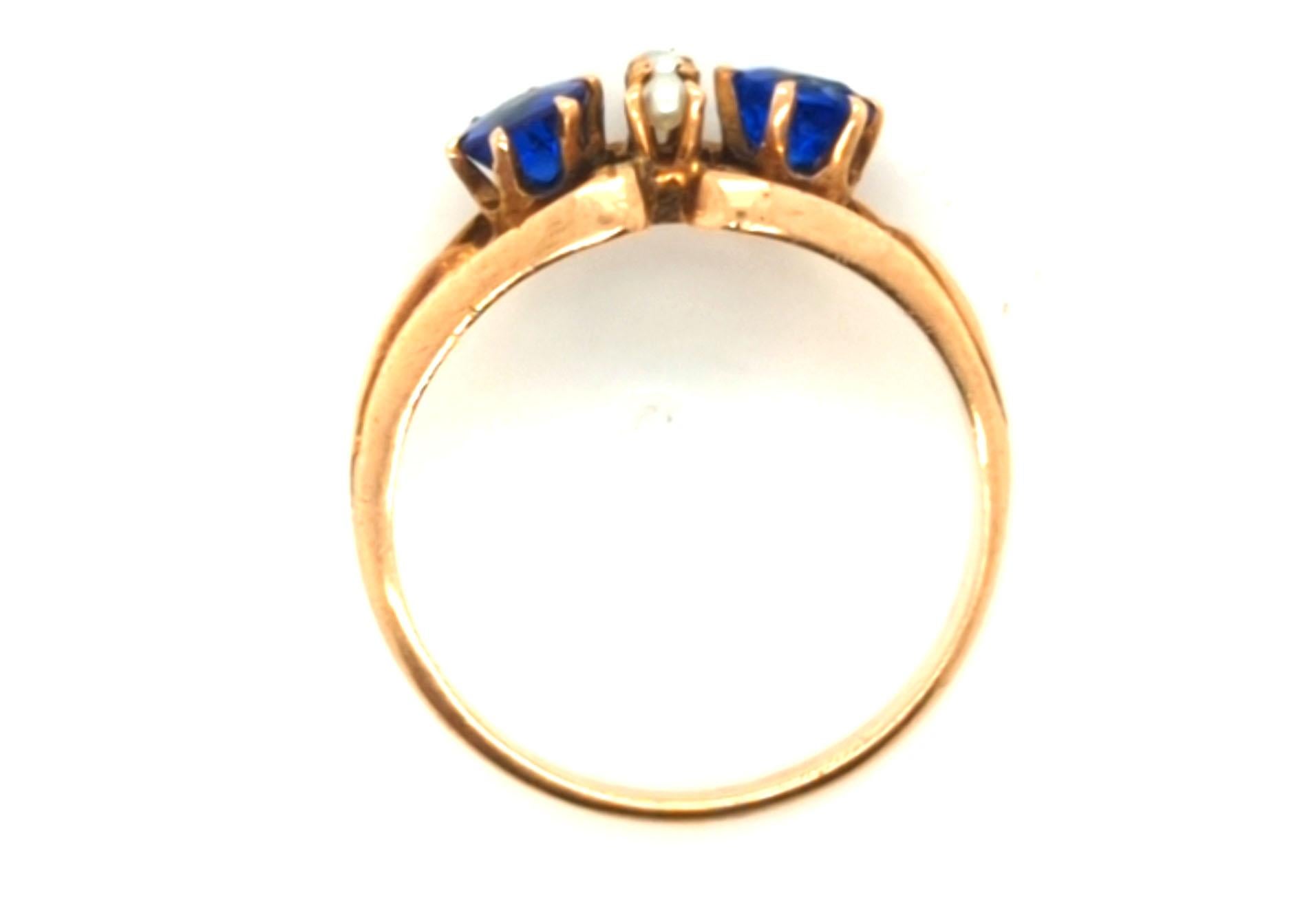 Genuine Original Victorian Antique from 1880's Lab Grown Sapphire Seed Pearl Ring .80ct Yellow Gold
 


Featuring Two Genuine Lab Grown Blue Round Cut Sapphire Gemstones

Sapphires are Accented With White Luster Natural Seed Pearls

Incredible Hand