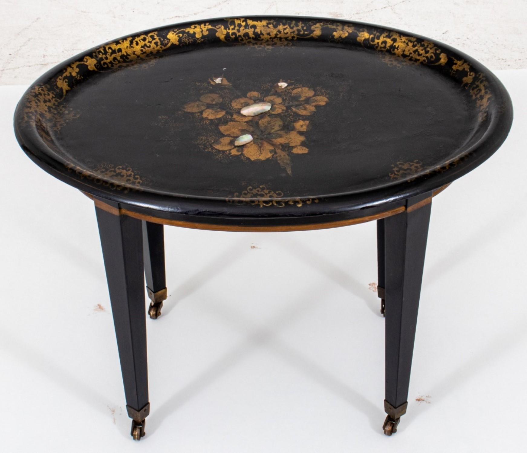 Victorian lacquered wood tray repurposed as a side table. The top is adorned with gilded floral motifs and inlaid mother-of-pearl accents.

Dealer: S138XX