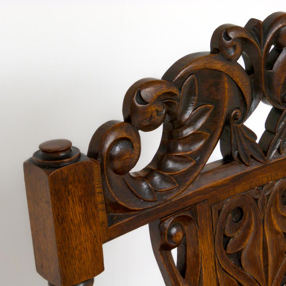 Very unusual ladies and gents Victorian oak chairs, both with beautifully carved crests and backs, the gents has spindled bobbin turned arms, whilst the ladies has short twisted side supports, as is more the tradition for nursing chairs in the day.