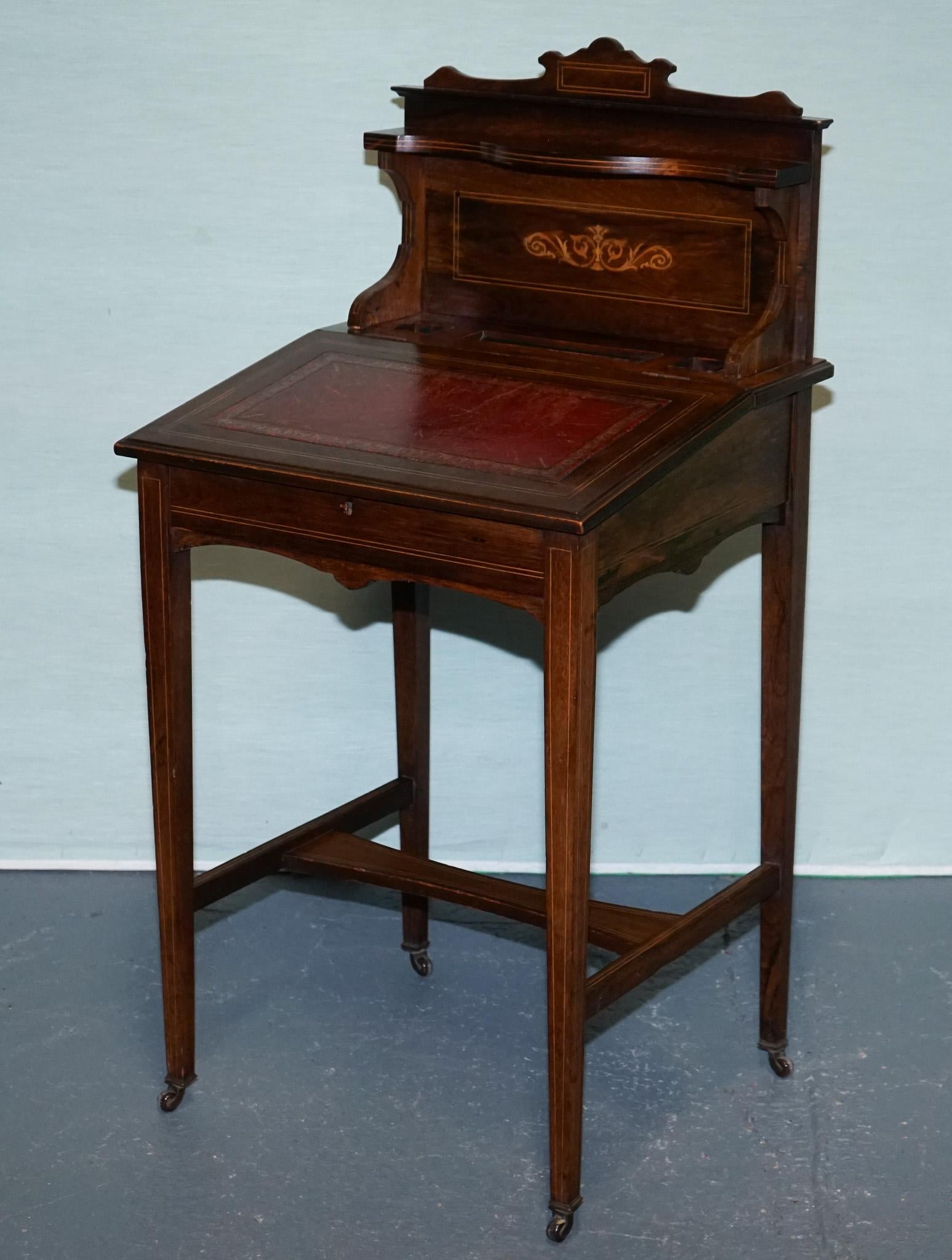 
Antiques of London



This is a fine Victorian rosewood Davenport desk dating from the mid to late 19th century, a compact and elegant writing desk designed for both practicality and display. The sloped top retains its original, tooled red leather