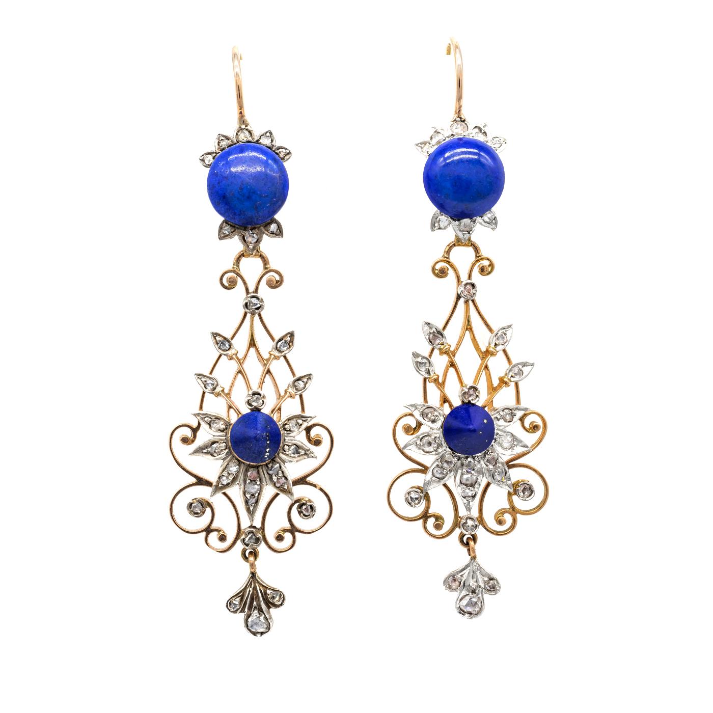 A pair of late Victorian, lapis lazuli and diamond, filigree drop earrings, the tops are set with round, cabochon-cut, lapis lazuli and rose-cut diamonds, suspending a gold, open work, pear shape pendant, with cone shaped lapis lazuli set within a