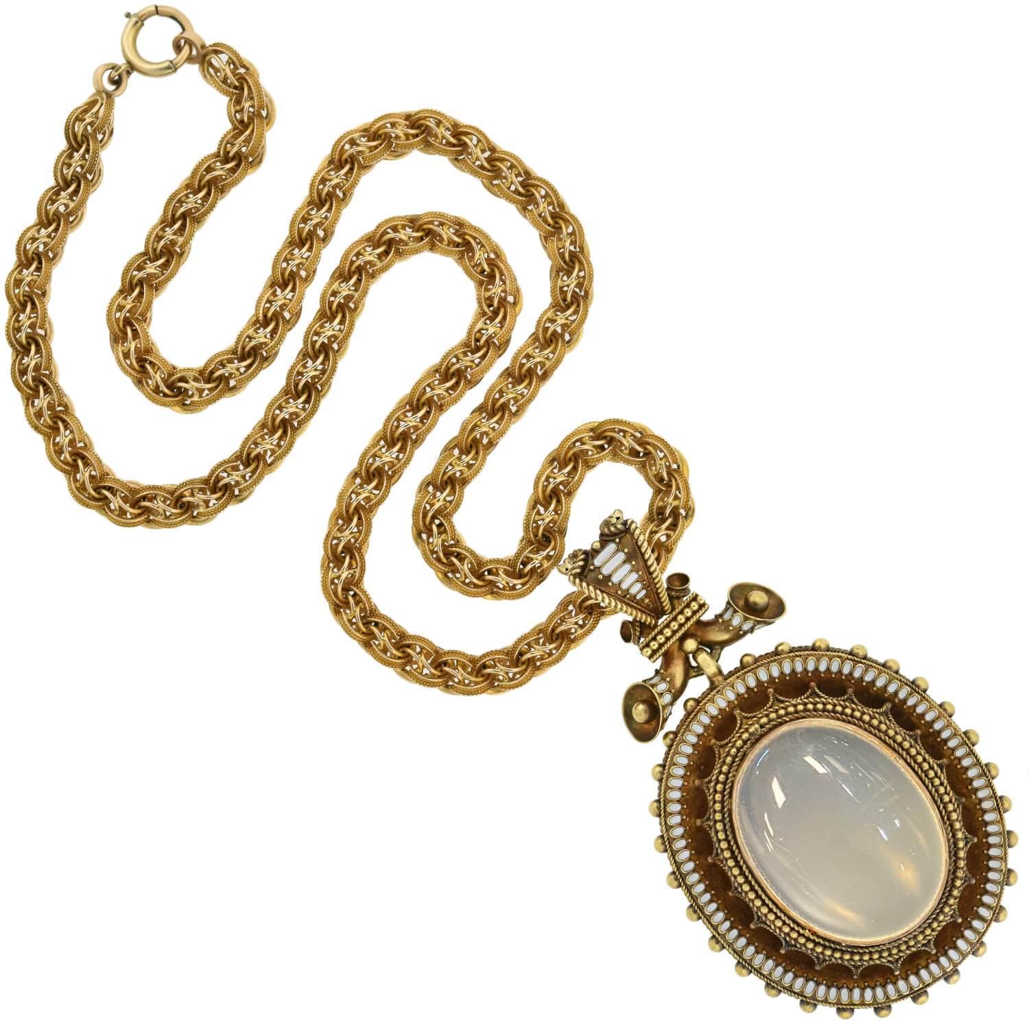 An absolutely magnificent moonstone pendant necklace from the Victorian (ca1880s) era! This incredible piece is comprised of a fantastic 18kt yellow gold pendant, which hangs from an ornate 14kt gold chain. The oval-shaped pendant is particularly