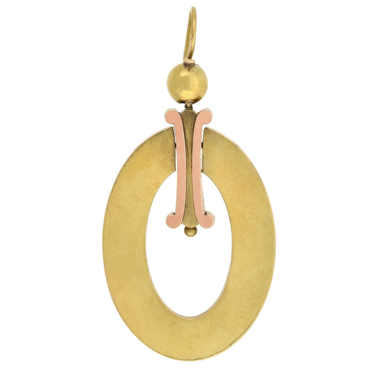 A very striking pair of two-tone gold earrings from the Victorian (ca1880s) era! These dramatic earrings are crafted in 15kt yellow and rose gold and are quite substantial in size. A large oval-shaped open hoop hangs in the center, attached to a