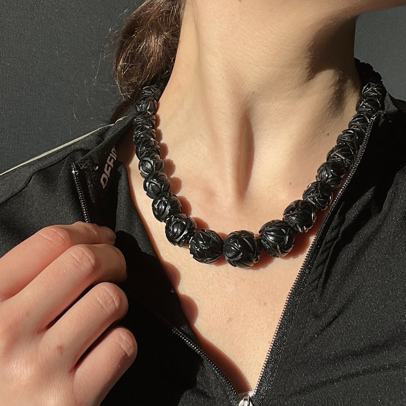 This stunning chunky necklace is held together by giant bolt clasp. The beads graduate in size, starting large at the centre and the smallest on the outer edges. 

Length: 44.5cm 
Largest Bead Diameter: 17mm
Smallest Bead Diameter: 10.5mm 

Weight: