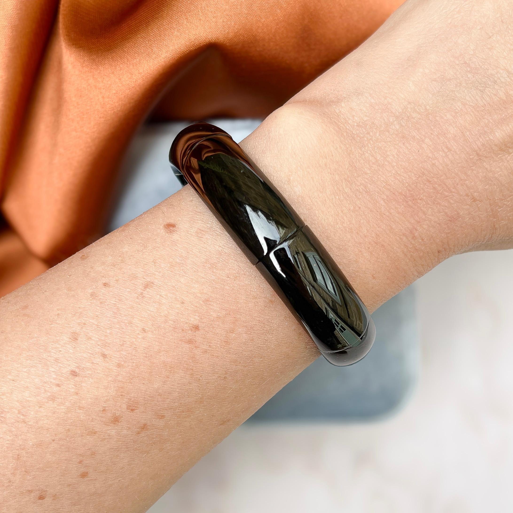 This stylish and beautifully polished Victorian Whitby Jet cuff is entirely original.  

Condition Report:
Excellent

The Details...
This chic cuff is constructed from Whitby Jet. It features highly polished and accurately shaped curved sections of