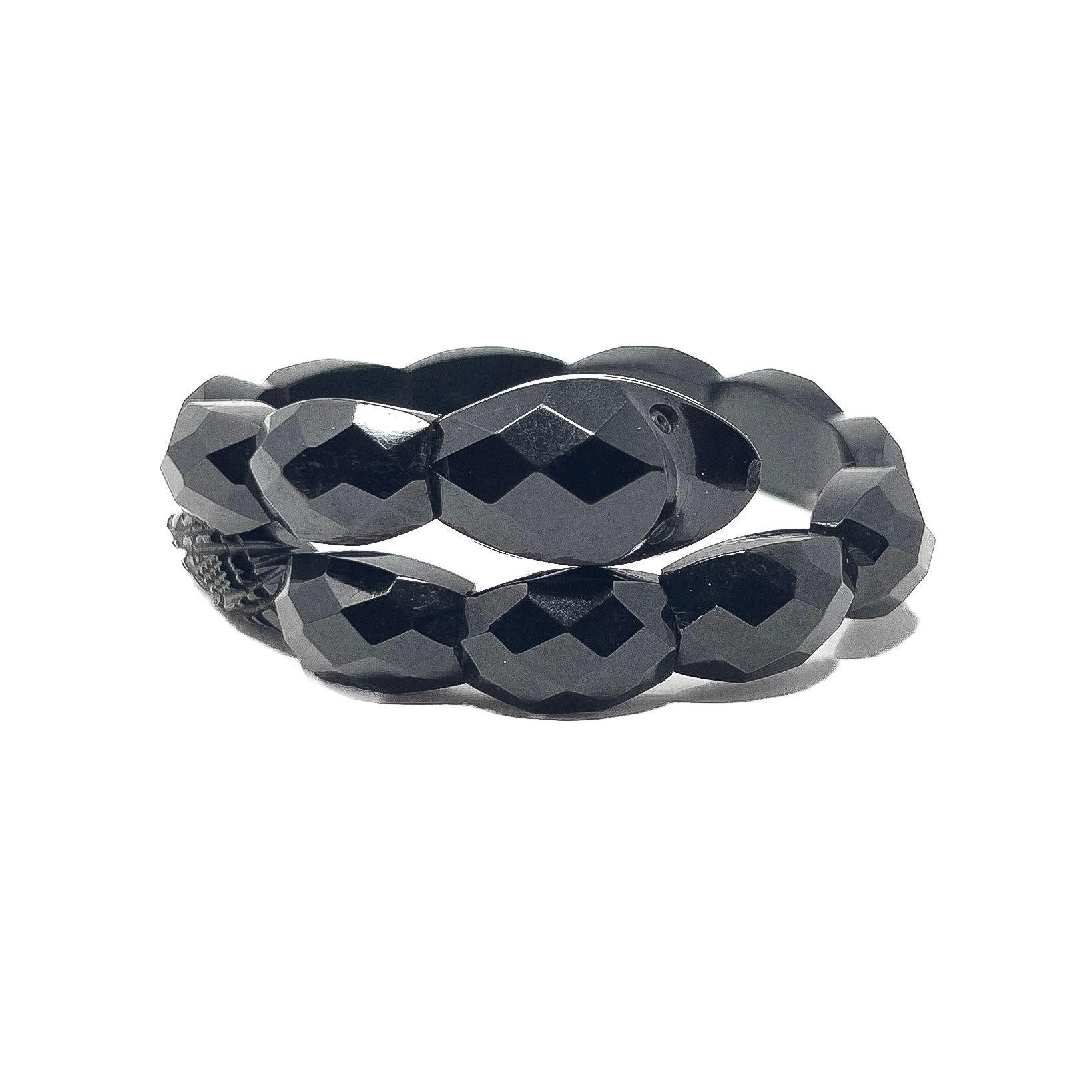 This beautiful Whitby Jet bracelet dates from the Victorian era. 

Condition Report:
Very Good - A little nibbling to the jet near the mouth of the snake. This is only visible upon very close inspection with a magnifying glass and does not detract