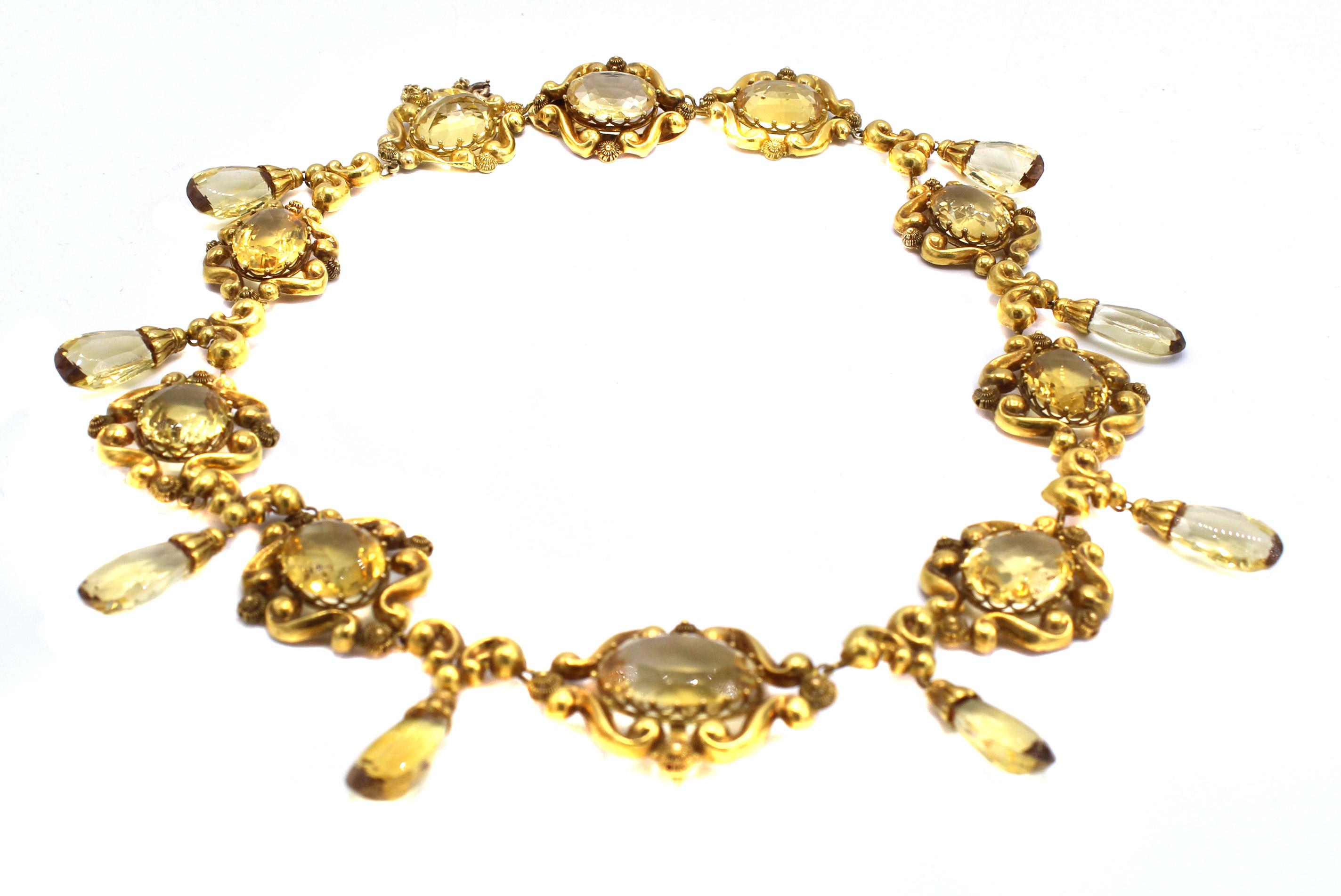 Beautifully designed and masterfully hand-crated this Victorian necklace from ca 1860 features 10 oval elements each set with an oval lemon citrine which are flexibly connected to 8 smaller elements which each have a briolette cut lemon citrine