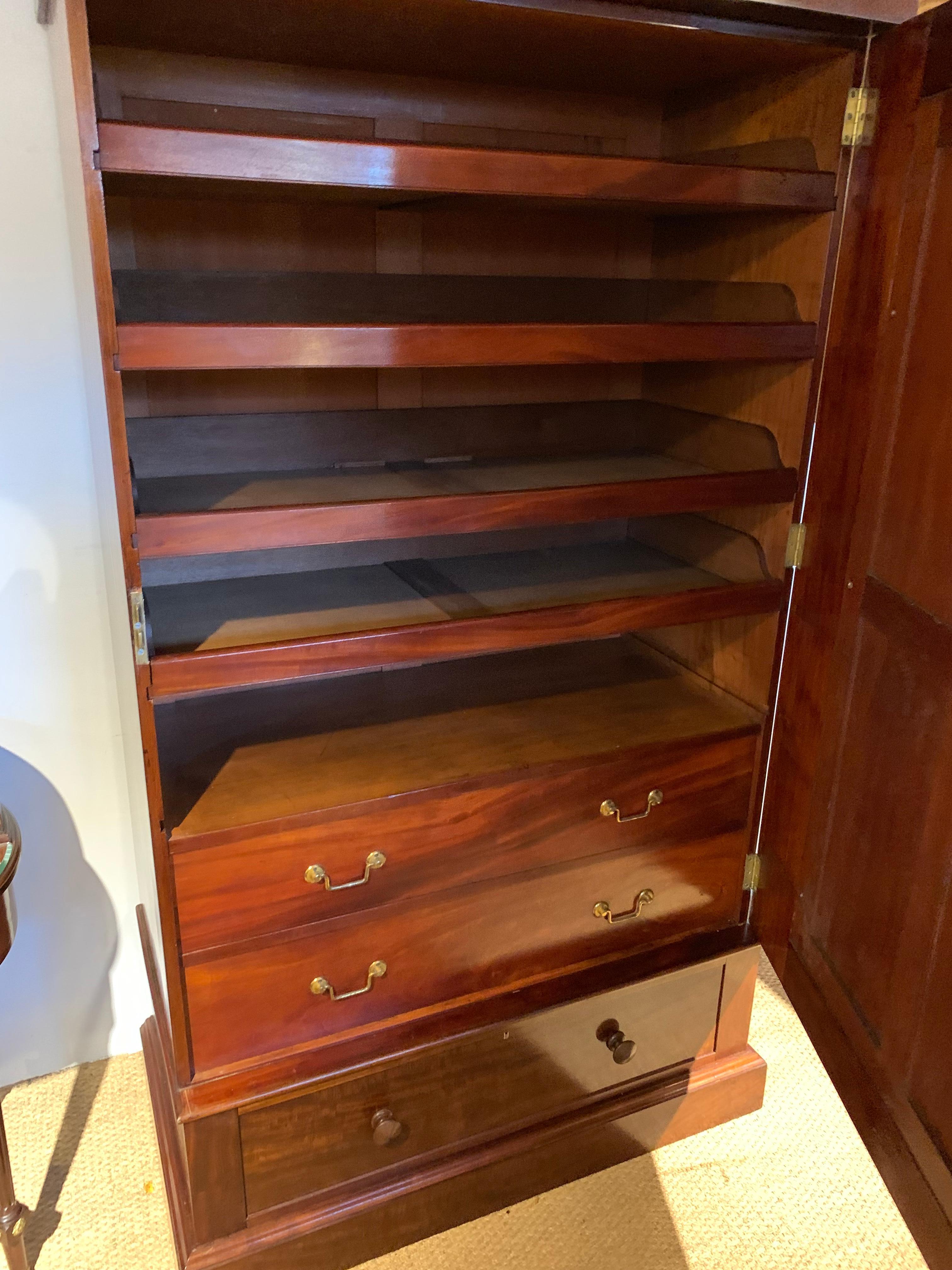 Unusual Victorian mahogany linen press
English dating to circa 1870s, with 4 original slides, 1 is missing but there is a useful shelf, 2 drawers with original brass handles, single drawer to the base original turned wooden handles
Measures: