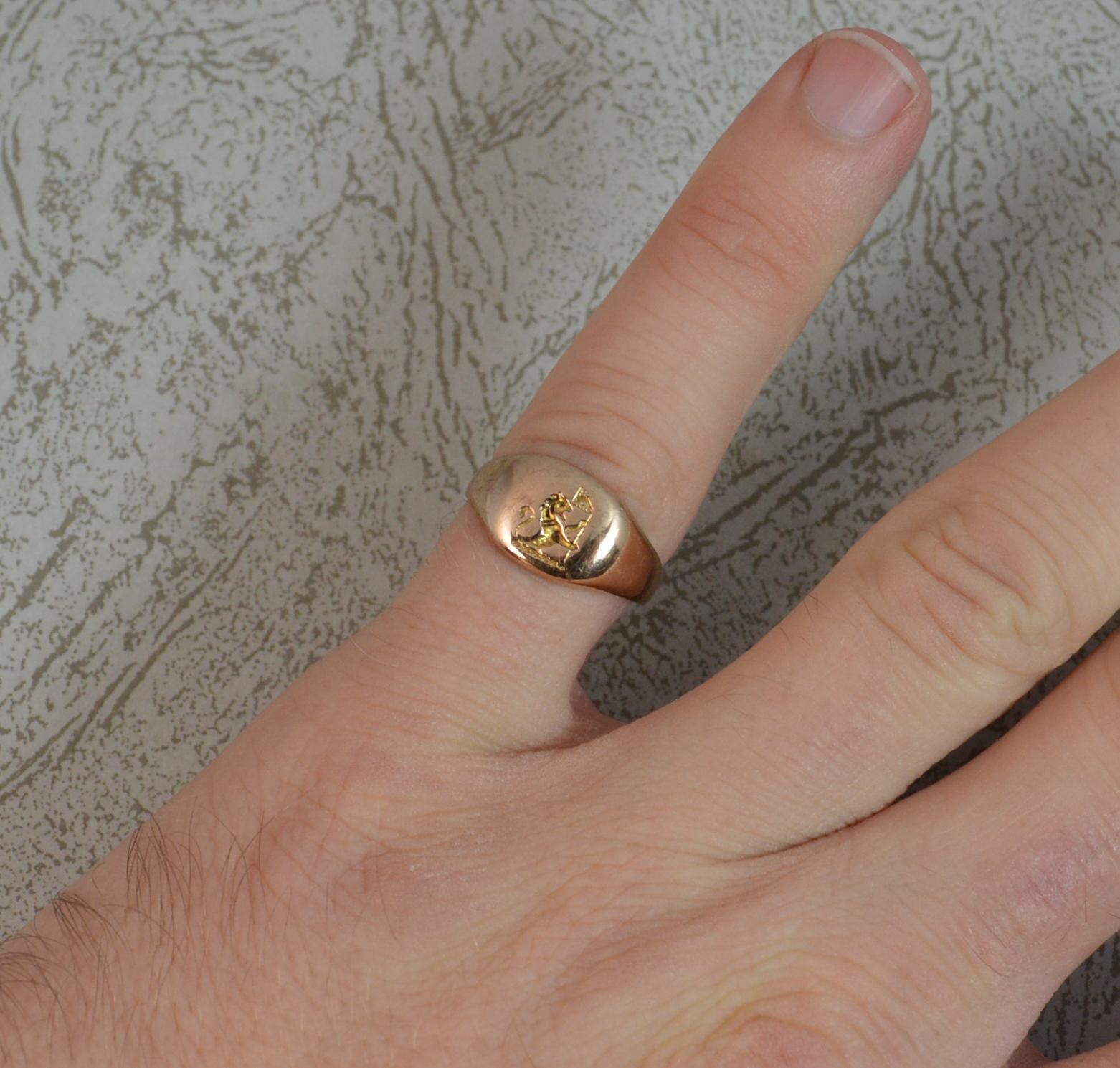A superb late Victorian period pinky signet ring.
9 carat rose gold example.
8.7mm wide head.
The intaglio depicts a lion passant holding a flag.

CONDITION ; Very good. Clean solid shank. Crisp intaglio.  Please view photographs.

WEIGHT ; 2.6