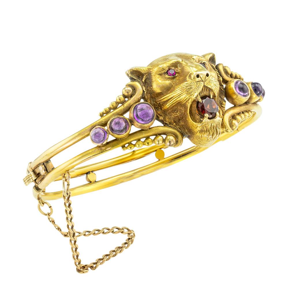 Victorian lion’s head hinged yellow gold bangle bracelet set with amethyst garnets and rubies circa 1890. *

ABOUT THIS ITEM:  #B1840. Scroll down for specifications.  Here you have a most impressive looking Victorian bangle bracelet centering upon