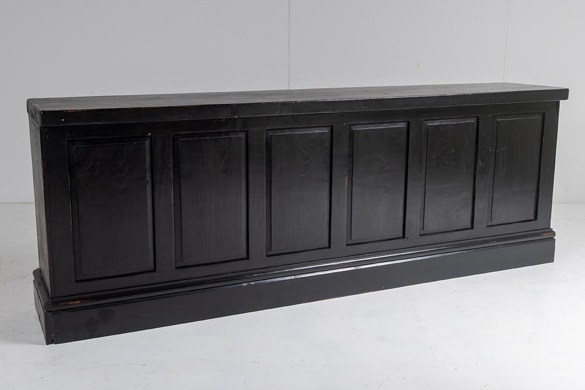 A lovely old Victorian pine ecclesiastical bookcase with panelled back and handy storage shelves.
A well made versatile piece with fixed shelves. Painted black ebonised finish to the outside with natural pine wood on the inside. Could be used as a