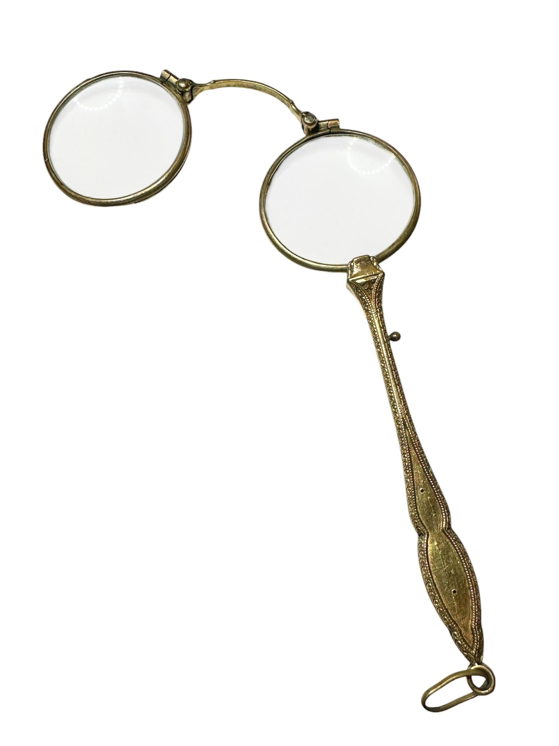 A gorgeous old fashioned antique lorgnette with a refined design on the handle. This pair of eyeglasses or opera glasses feature a 
