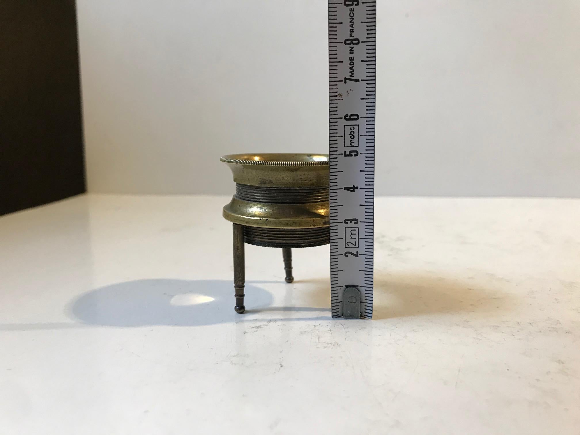 antique magnifying glass on stand