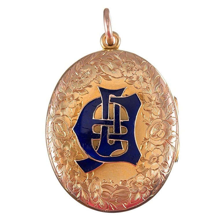 An incredible souvenir of love and a rather rare antique, the locket is made of 18k yellow gold and generously endowed with a floral engraved pattern. The front and back boast rich royal blue enamel- the back of a stylized monogram and the front
