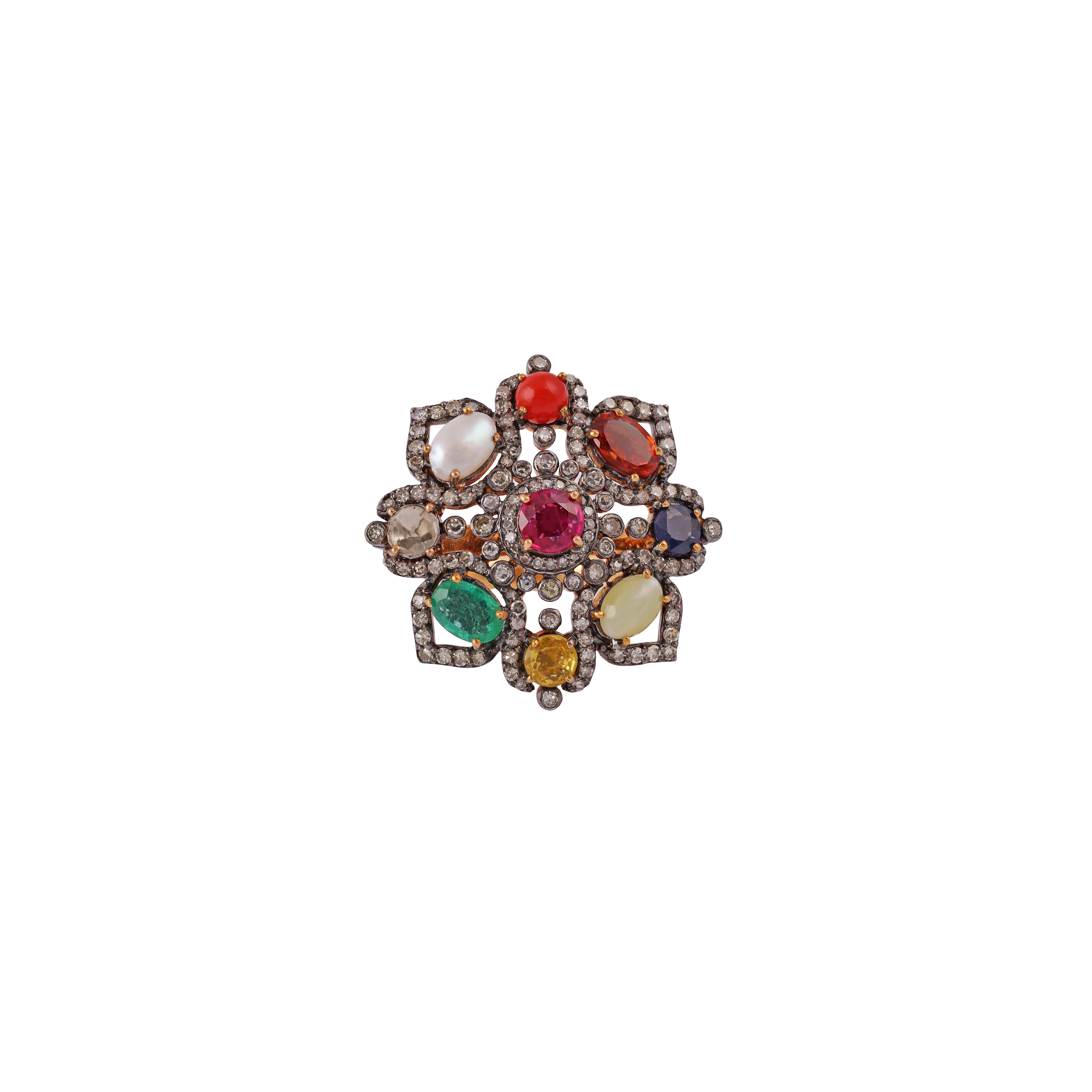 9-Gems (Ruby, Blue Sapphire, Emerald, Yellow Sapphire, Cat's Eye, Uncut Diamond , Moon Stone, Garnet) 2.07 carats with Diamond 1.08 carat Ring set in 18 Karat Gold And silver.

Gold -1.86 gm
silver - 4.3 gm
The 9-gems are believed represent good