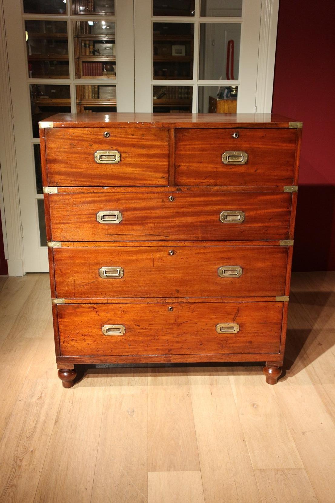 Beautiful antique mahogany Campaign chest with secretary from Ross & Co from Dublin. There is a secretary in the upper right drawer. The desk is beautifully finished with burr walnut around the leather and the drawers feature bleached maple veneer.