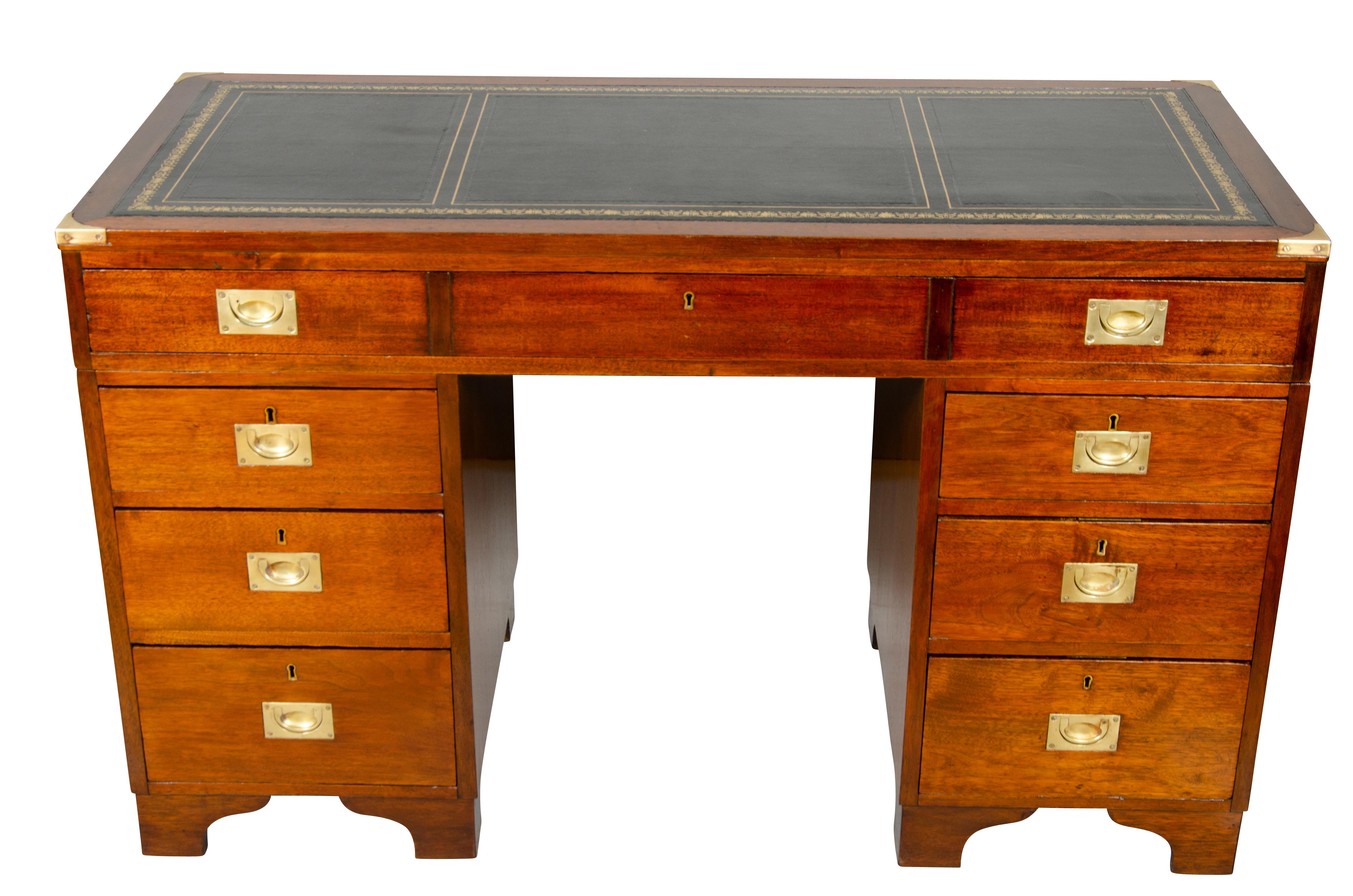 With a rectangular top with black leather set in a wood framed border, over a long drawer all seated on two pedestals each with three drawers, bracket feet. Stamped by maker Arthur Foley & Sons, Salisbury, 1891. The back of the desk is in finished