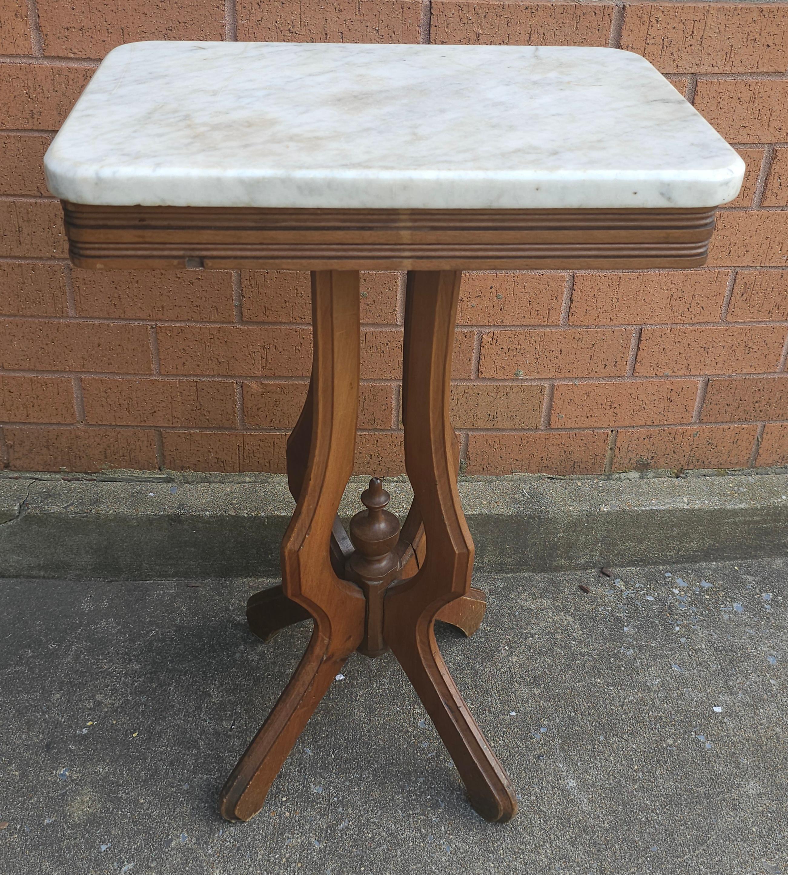 A 19th Century Victorian Mahogany and Marble Top Side Table. Measures 19
