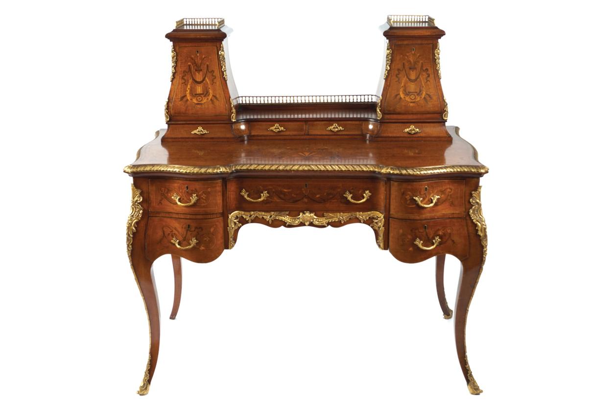Late Victorian ormolu-mounted mahogany and marquetry ladies writing desk, circa 1880. The rectangular top with serpentine sides at the front, below lyre inlaid miniature cabinets surmounted by brass gallery rails, over a series of five drawers and