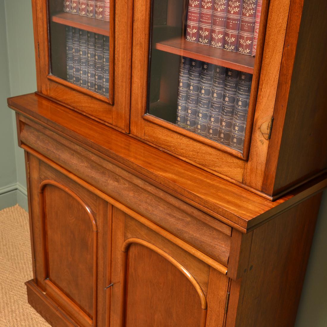 Beautiful Victorian mahogany antique glazed bookcase on cupboard

Constructed from beautifully figured mahogany, this splendid bookcase dates from around 1860 and has a moulded cornice above two glazed doors with arched mouldings and key with