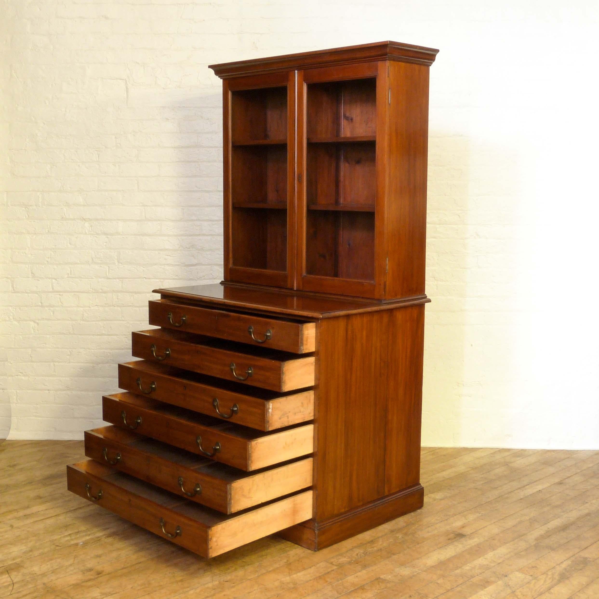 This is a fine quality mahogany architects bookcase, unusual in that very few have the bookcase top. Even the more traditionally deep drawers have superb bronzed heavy duty handles, all in great condition. An exceptional piece of it's type, with the