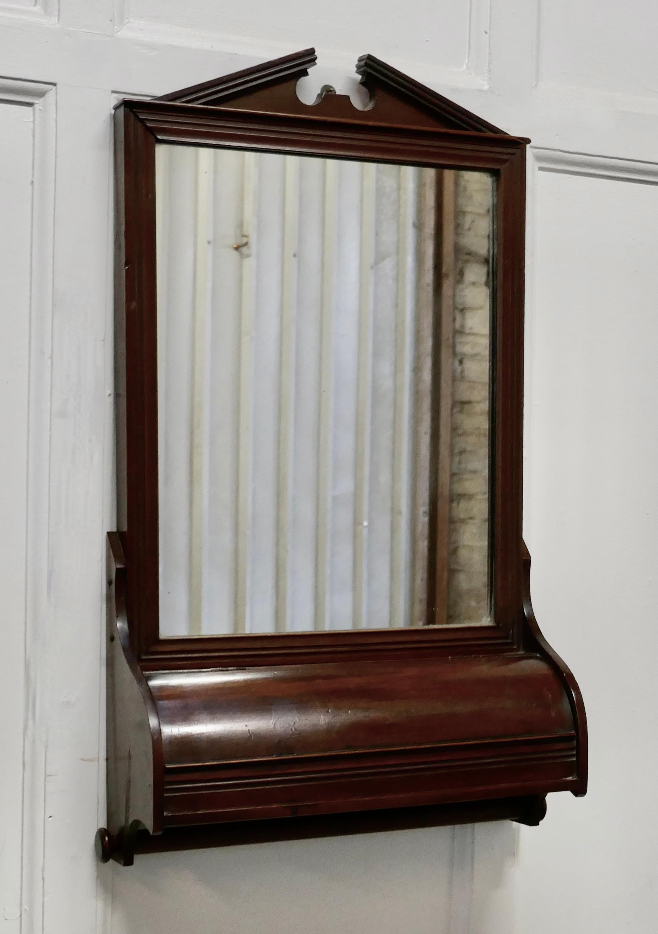 Victorian mahogany bathroom wall mirror with towel rail

This is a very attractive piece, which would work very well in a bathroom or cloak room
The mirror has a swan neck pediment at the top and small compartment for storage and below this there