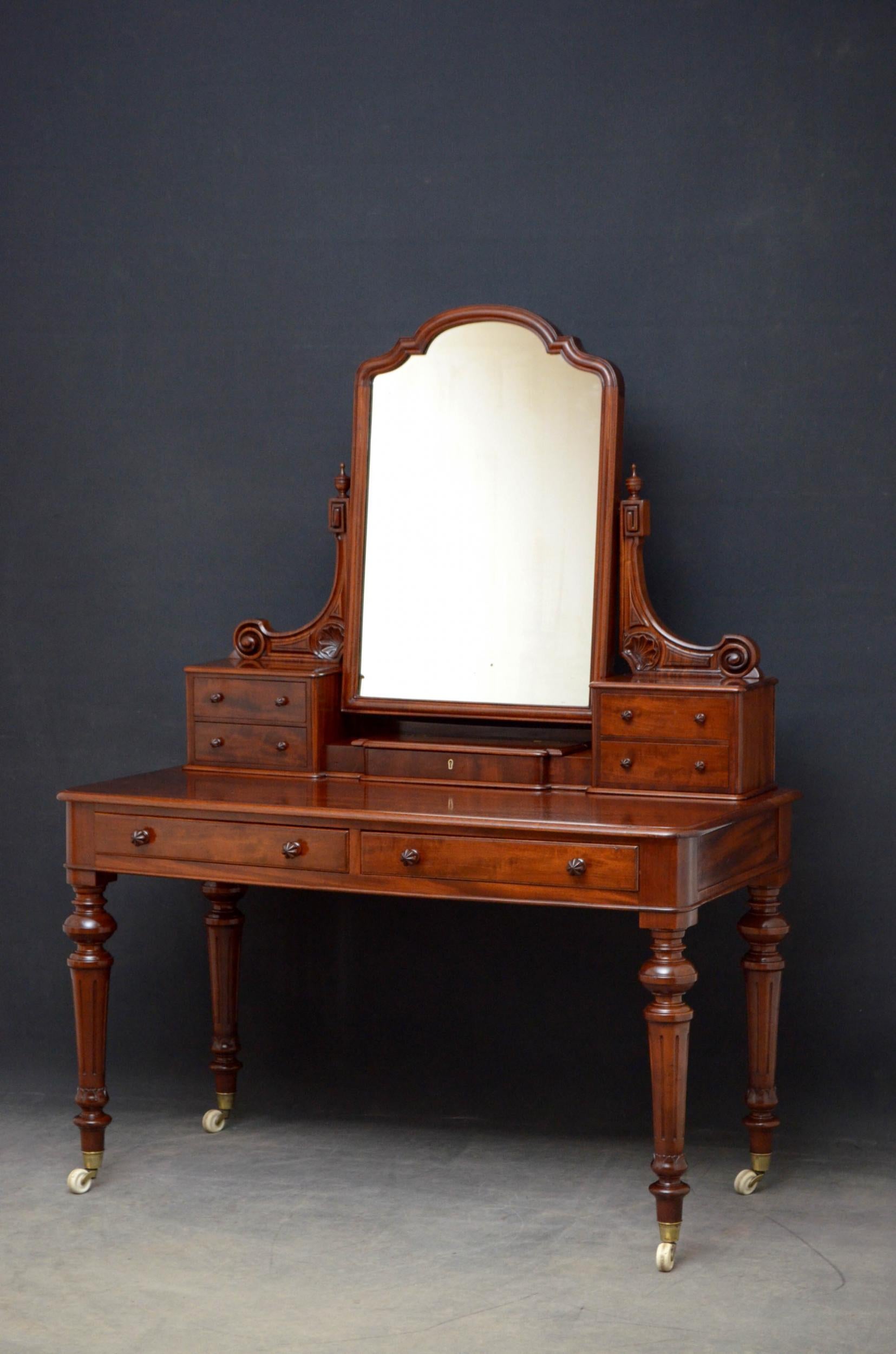 Victorian mahogany two-piece bedroom set. Sn4869 fine quality Victorian wardrobe of generous proportions, having moulded outswept cornice above a pair of arched and paneled figured mahogany doors fitted with original glass knob and enclosing short